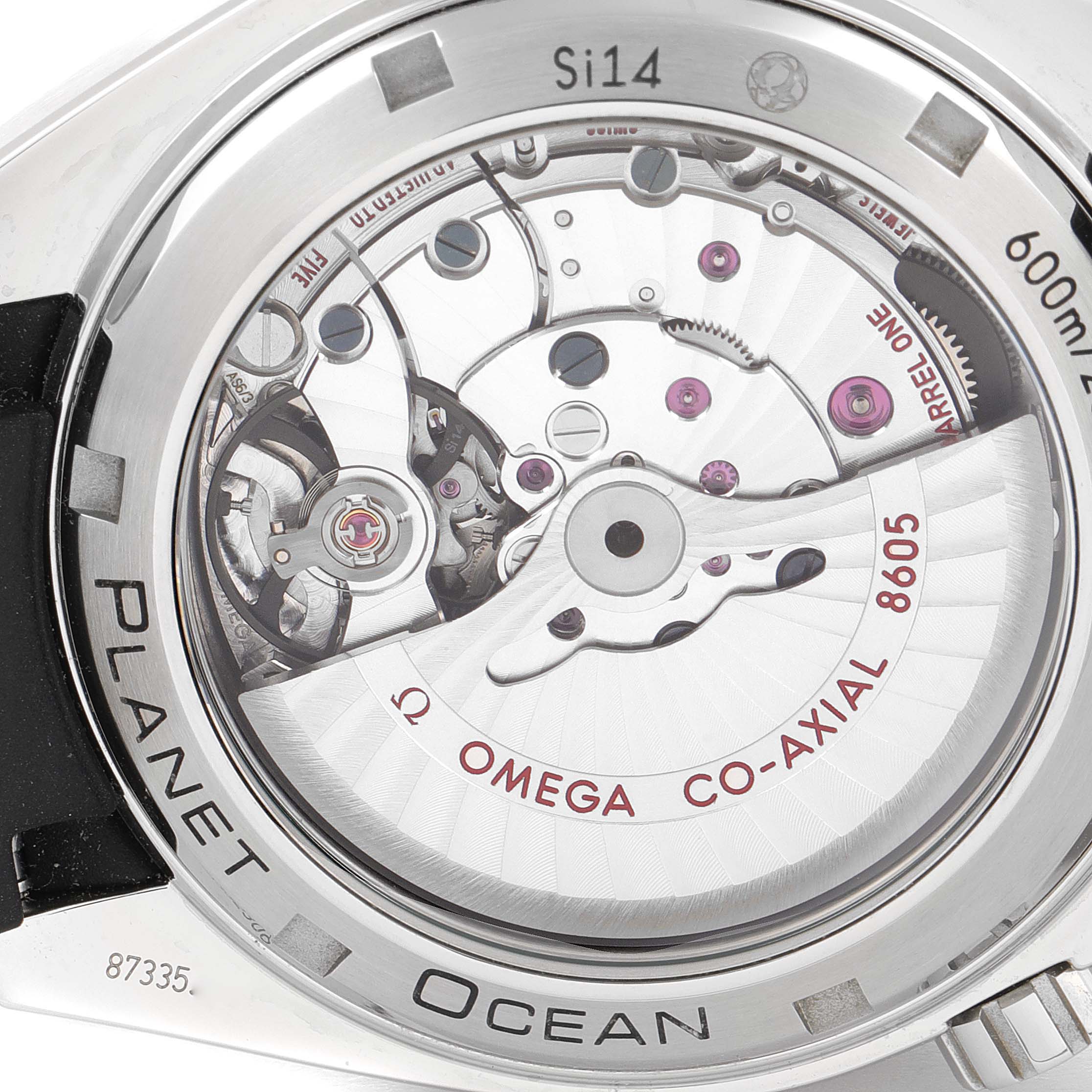 The image shows the back view of the Omega Planet Ocean 232.32.44.22.01.002 Men's Stainless Steel Black Dial 232.32.44.22.01.002 Men's Stainless Steel Black Dial watch, highlighting its exposed co-axial 8605 movement.