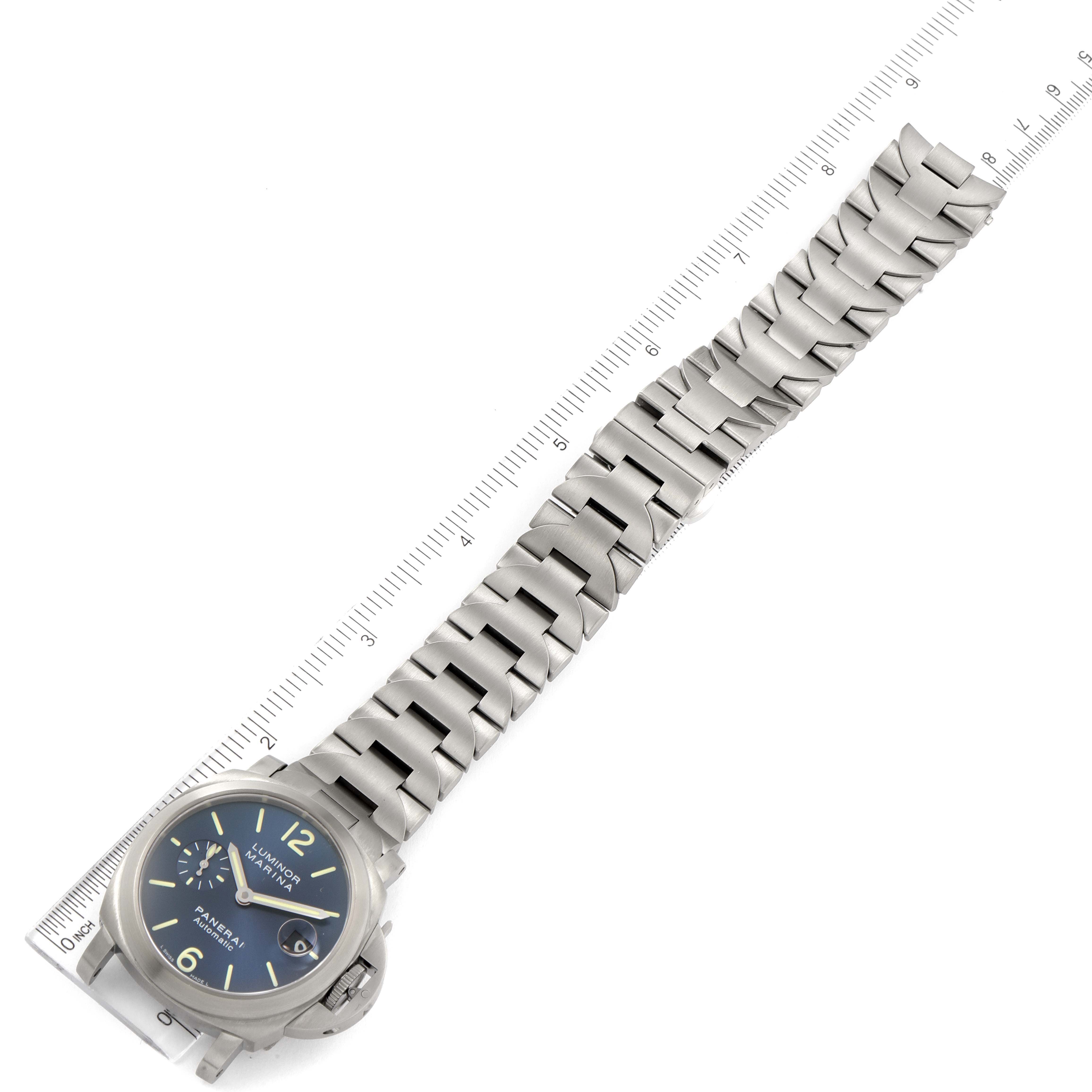 The image shows a top-down view of a Panerai Luminor PAM00283 Men's Titanium Blue Dial PAM00283 Men's Titanium Blue Dial watch with a stainless steel bracelet and a ruler for scale.