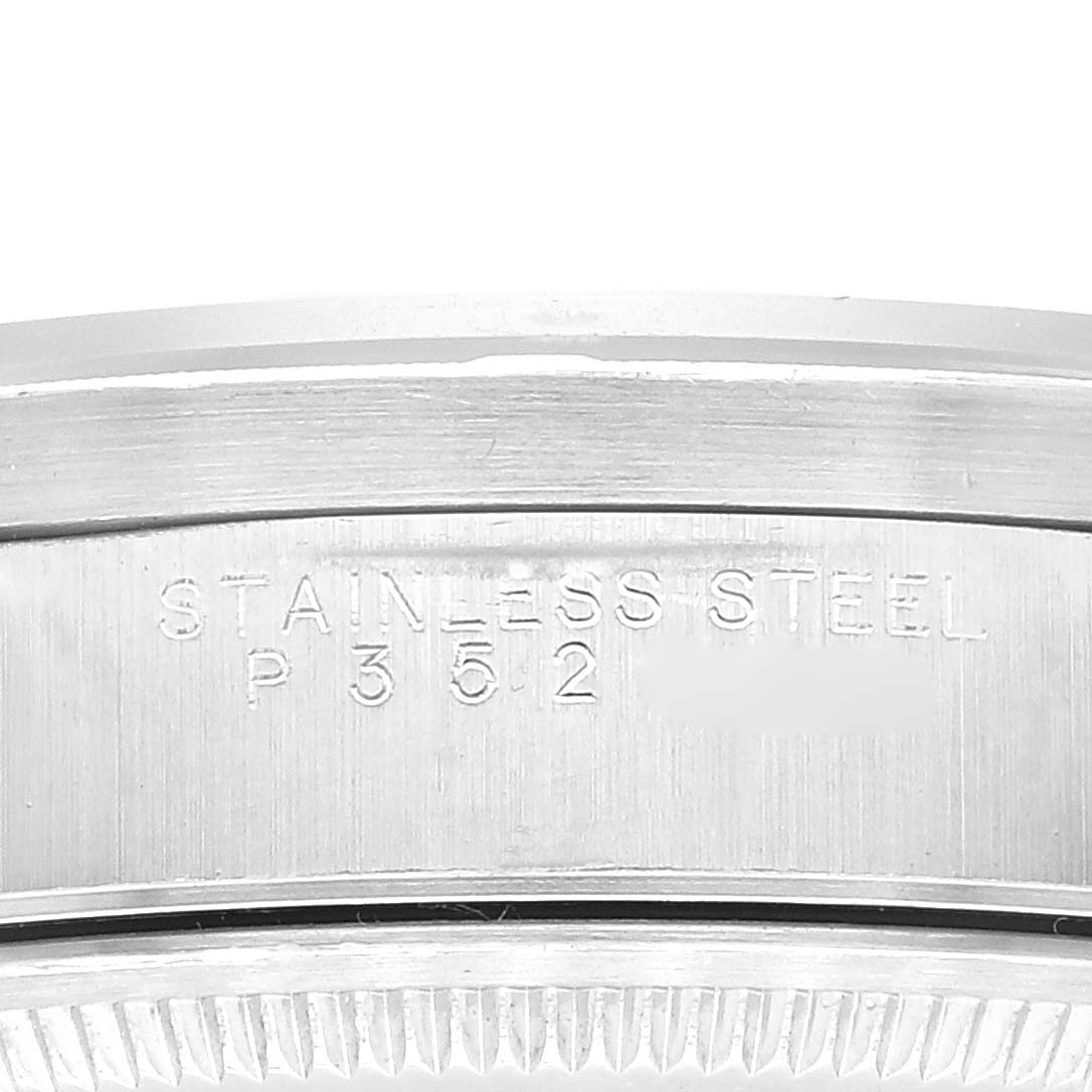 This image shows a close-up of the stainless steel case back rim with inscriptions on a Rolex Air-King 14010 Men's Stainless Steel Black Dial 14010 Men's Stainless Steel Black Dial watch.