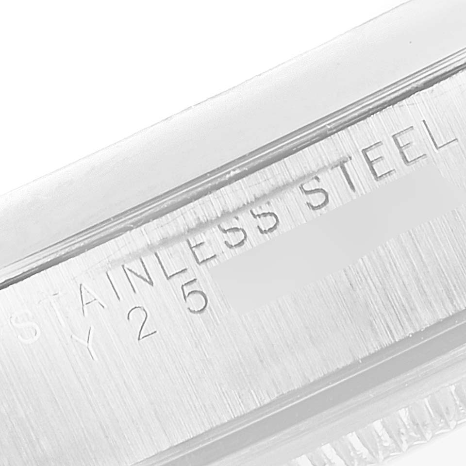 The image shows a close-up view of the stainless steel case of a Rolex Air-King 14000 Men's Stainless Steel White Dial 14000 Men's Stainless Steel White Dial watch, featuring engraved text.