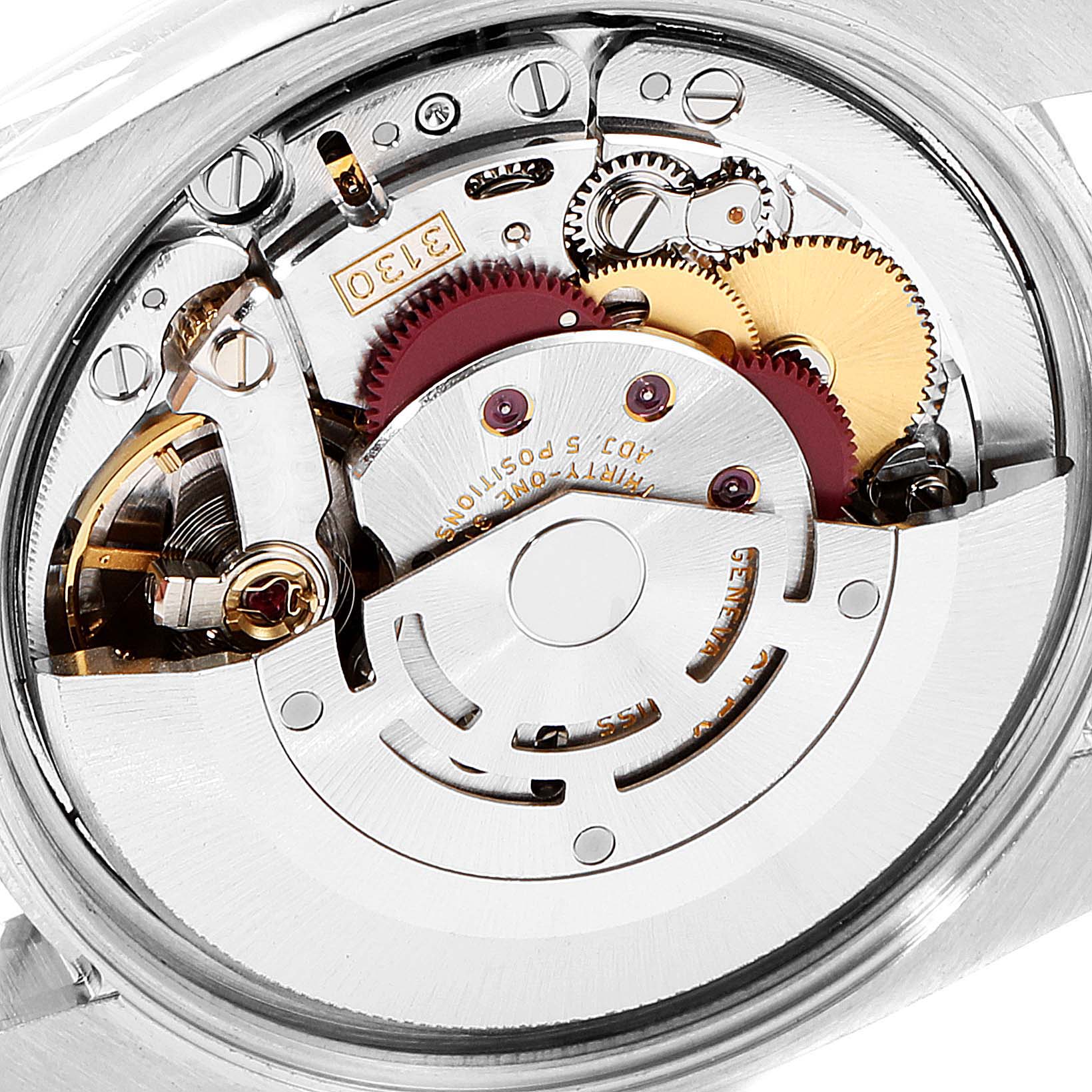 The image shows the internal mechanism of a Rolex Air-King 114210 Men's Stainless Steel Silver Dial 114210 Men's Stainless Steel Silver Dial watch, focusing on its gears, rotors, and movement components.