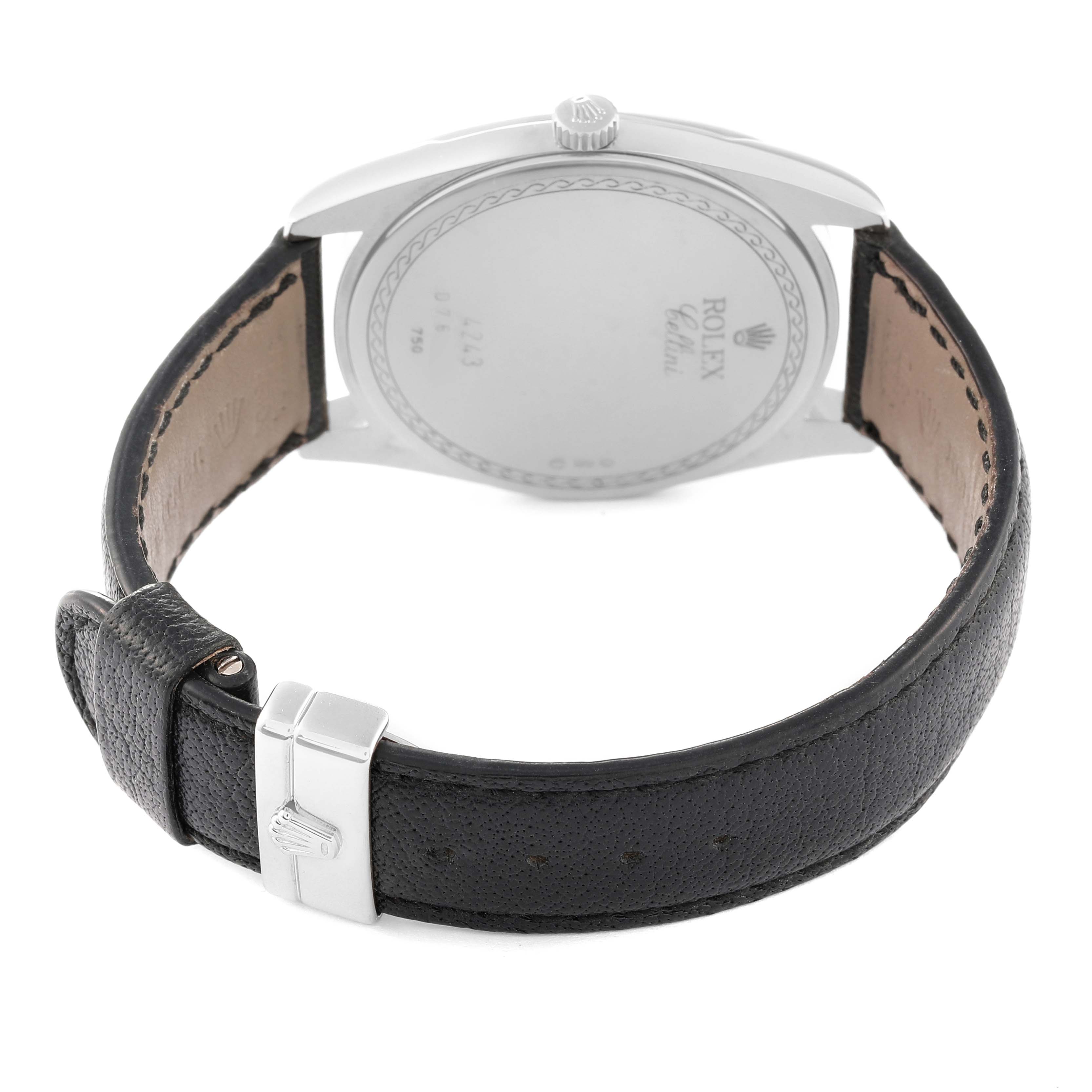 The image shows the back view of a Rolex Cellini 4243/9 Men
s White Gold Silver Dial 4243/9 Men
s White Gold Silver Dial watch with its leather strap and buckle.