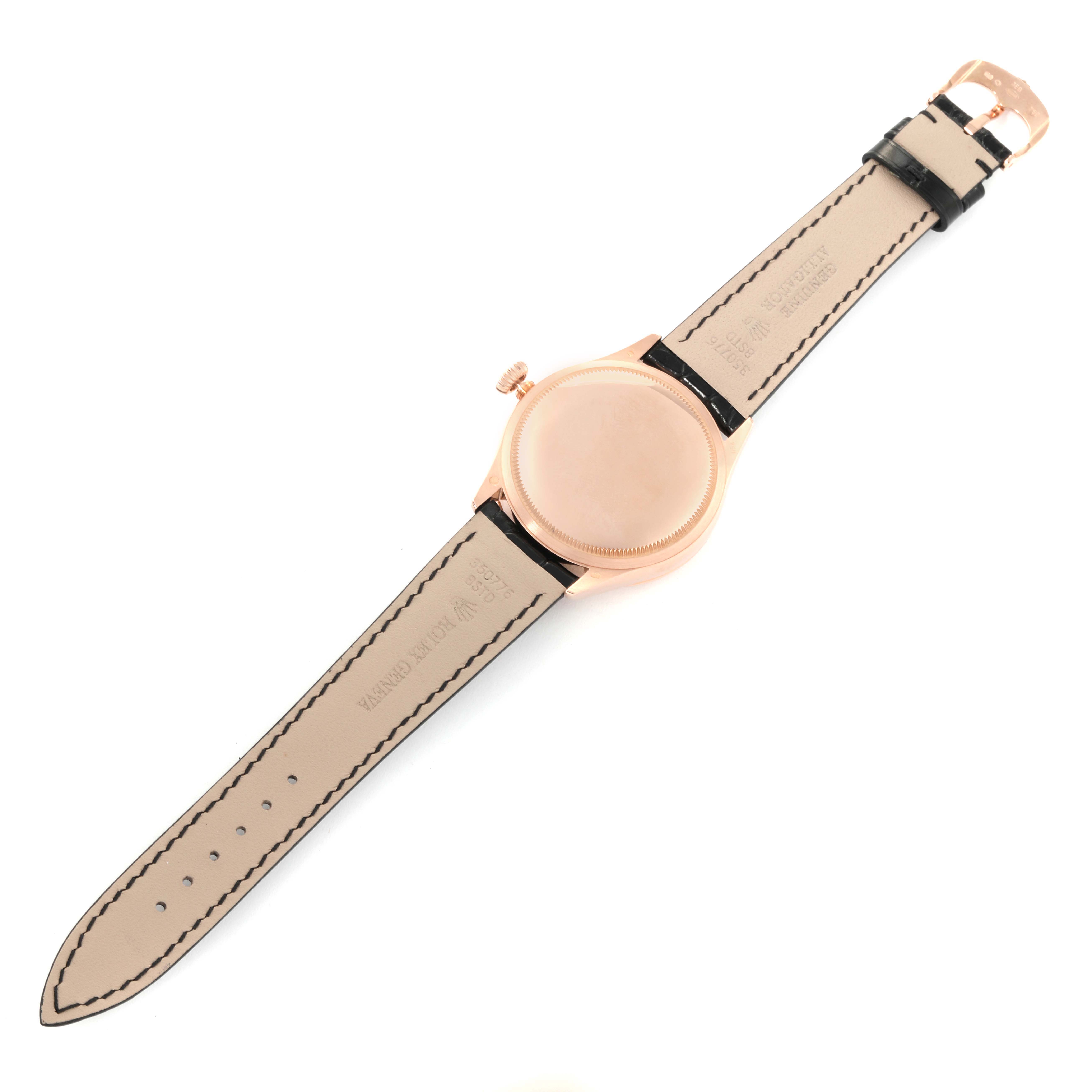 The Rolex Cellini 50515 Men's Rose Gold Silver Dial 50515 Men's Rose Gold Silver Dial watch is shown from a top-down angle, displaying its back case and leather straps.