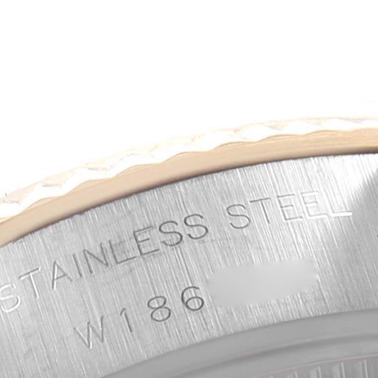 This image shows a close-up of the bezel and stainless steel case of a Rolex Datejust 69173 Men's Steel and Gold (two tone) Champagne Dial 69173 Men's Steel and Gold (two tone) Champagne Dial watch.