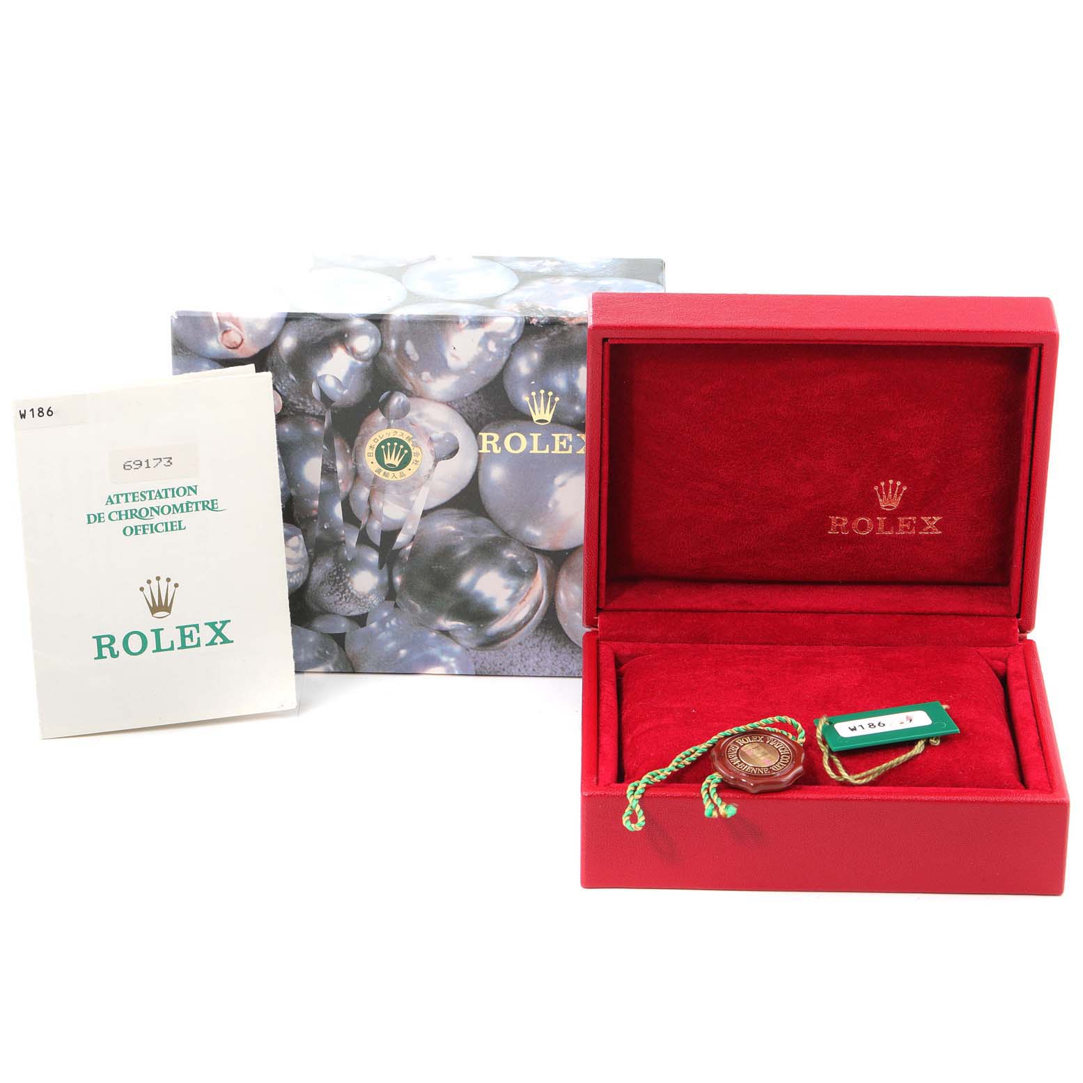 The image shows the Rolex Datejust 69173 Men's Steel and Gold (two tone) Champagne Dial 69173 Men's Steel and Gold (two tone) Champagne Dial box, certification booklet, and tags from a front angle.