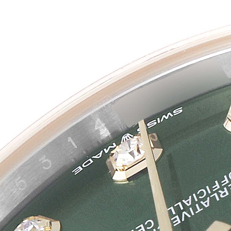 This close-up image shows the dial, hour markers, and part of the bezel of a Mid-Size Rolex watch.