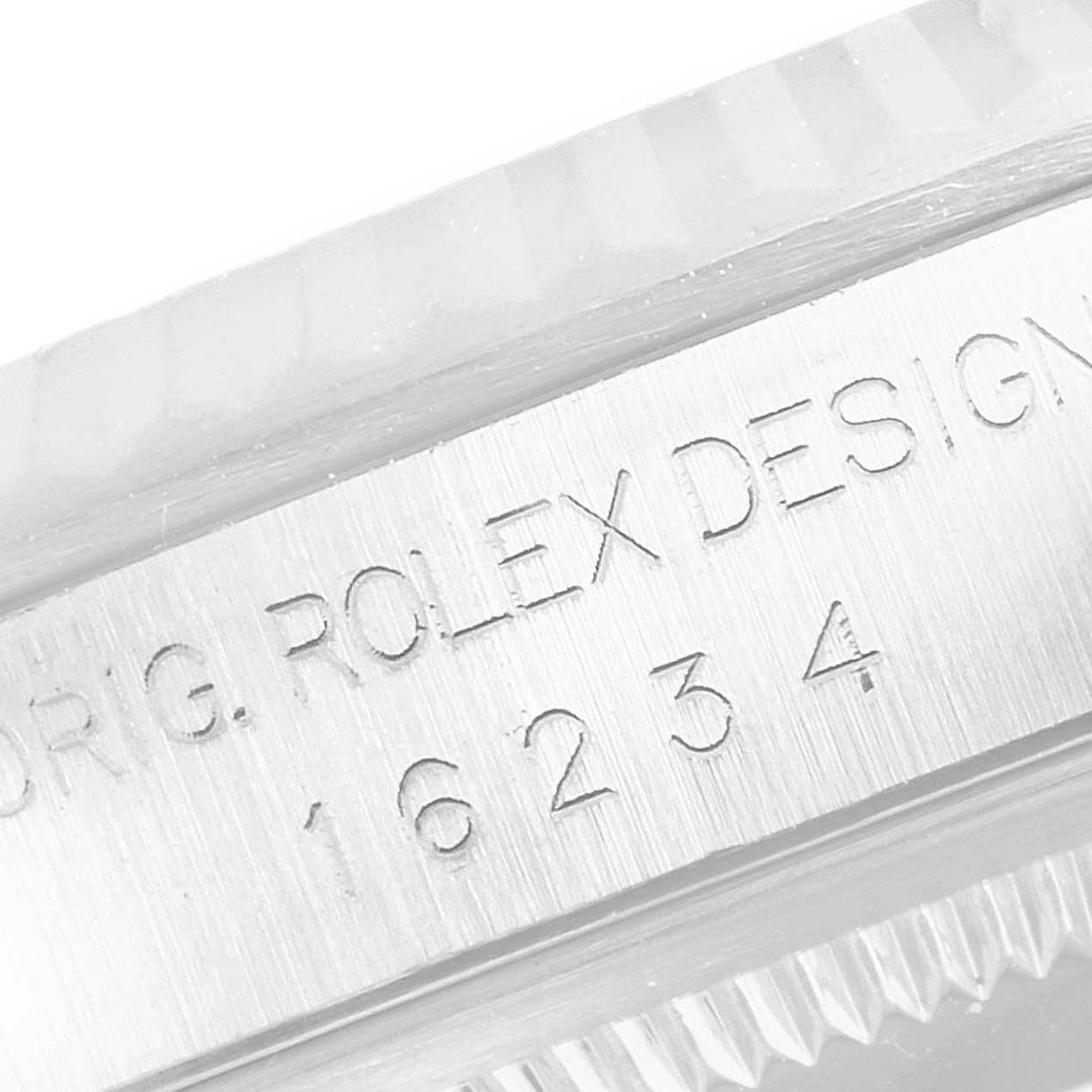 This is a close-up shot of the case side of a Rolex Datejust 16234 Men's Stainless Steel Black Dial 16234 Men's Stainless Steel Black Dial watch showing engraved details.