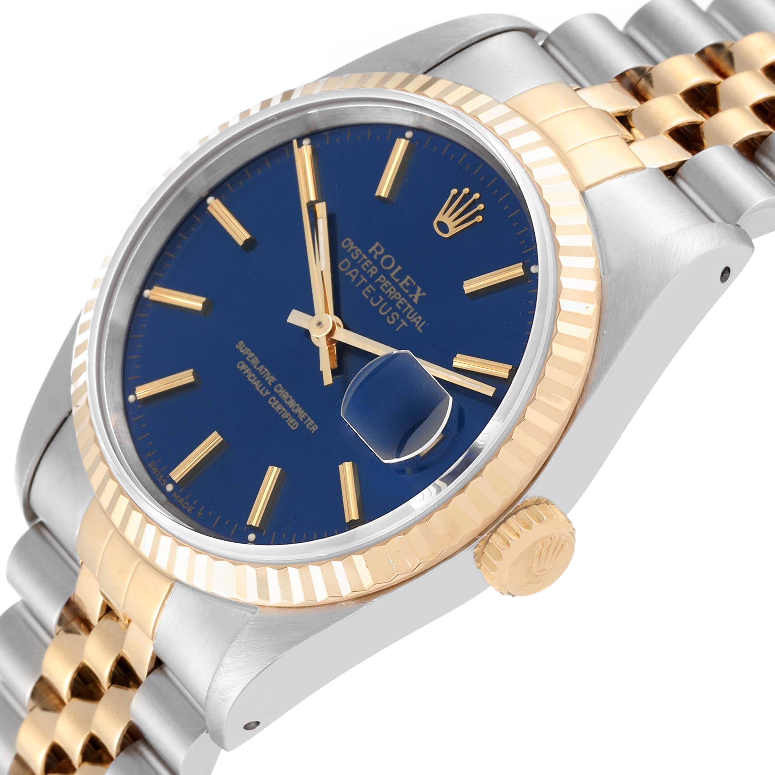 This image shows a side angle view of the Rolex Datejust 16233 Men's Steel and Gold (two tone) Blue Dial 16233 Men's Steel and Gold (two tone) Blue Dial watch, highlighting the blue dial, gold fluted bezel, and two-tone bracelet.
