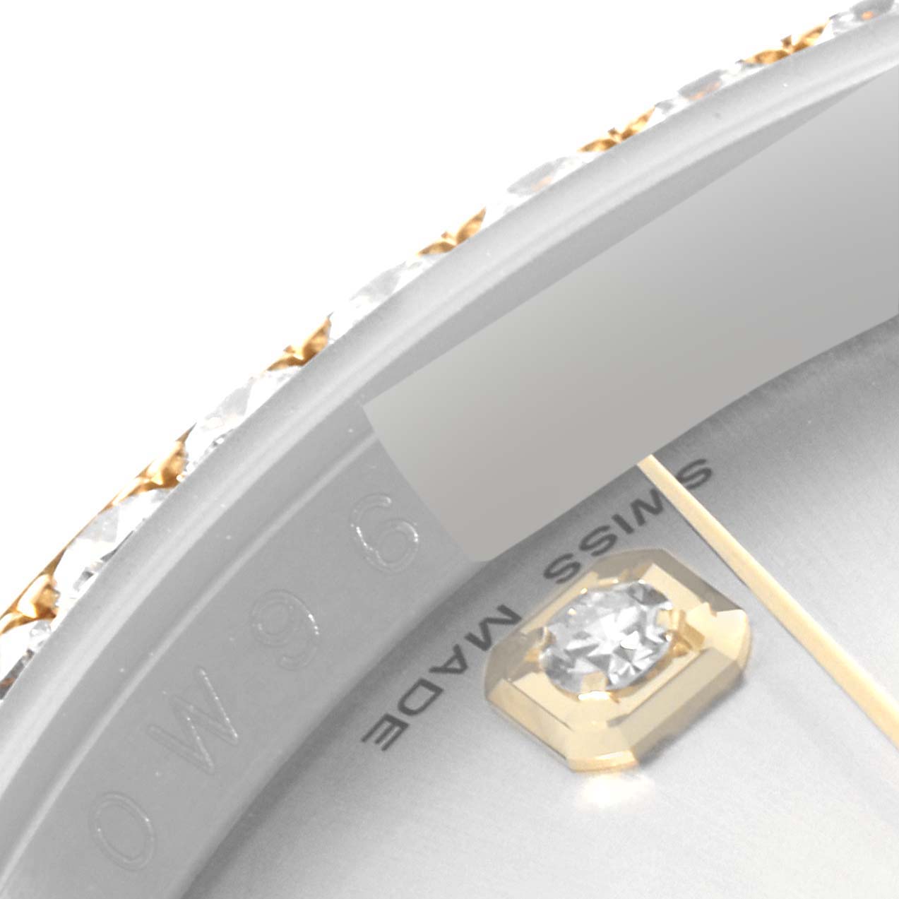 The image shows an extreme close-up angle of the Rolex Datejust 116243 Men's Steel and Gold (two tone) Silver Dial 116243 Men's Steel and Gold (two tone) Silver Dial dial, featuring a diamond marker and part of the bezel.