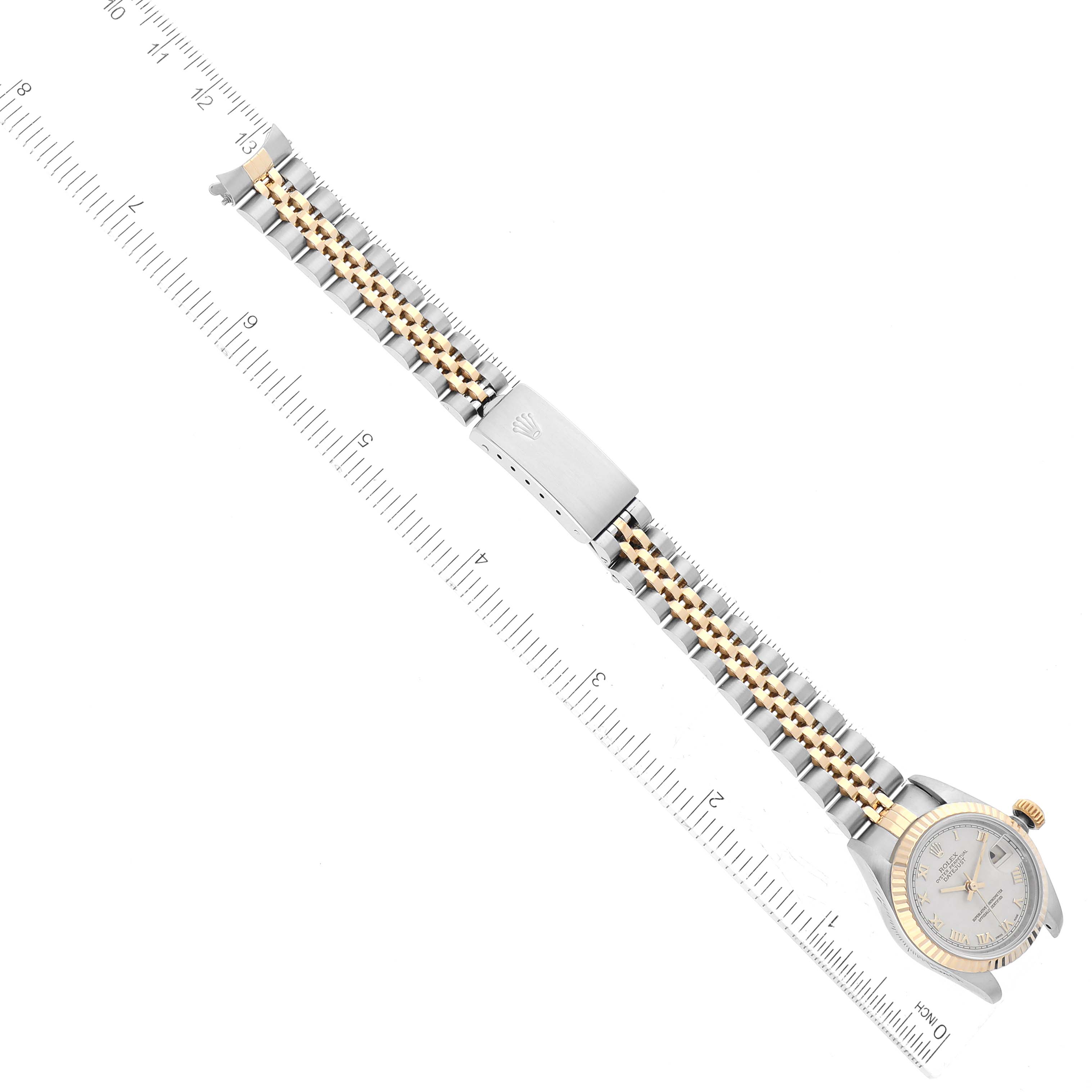 This image shows a top-down view of the Rolex Datejust 69173 Women's Steel and Gold (two tone) White Dial 69173 Women's Steel and Gold (two tone) White Dial watch, including its dial, bezel, and jubilee bracelet with a measuring scale.