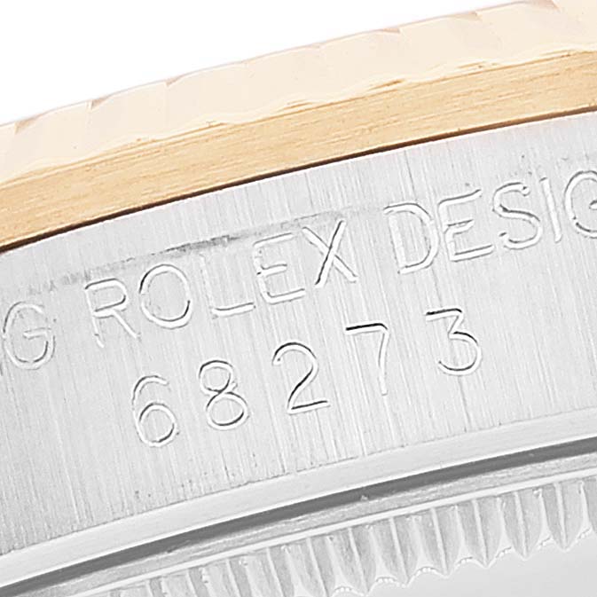 This image shows the side view of the Mid-Size Rolex watch case, displaying its engraved serial number and "ROLEX DESIGN."