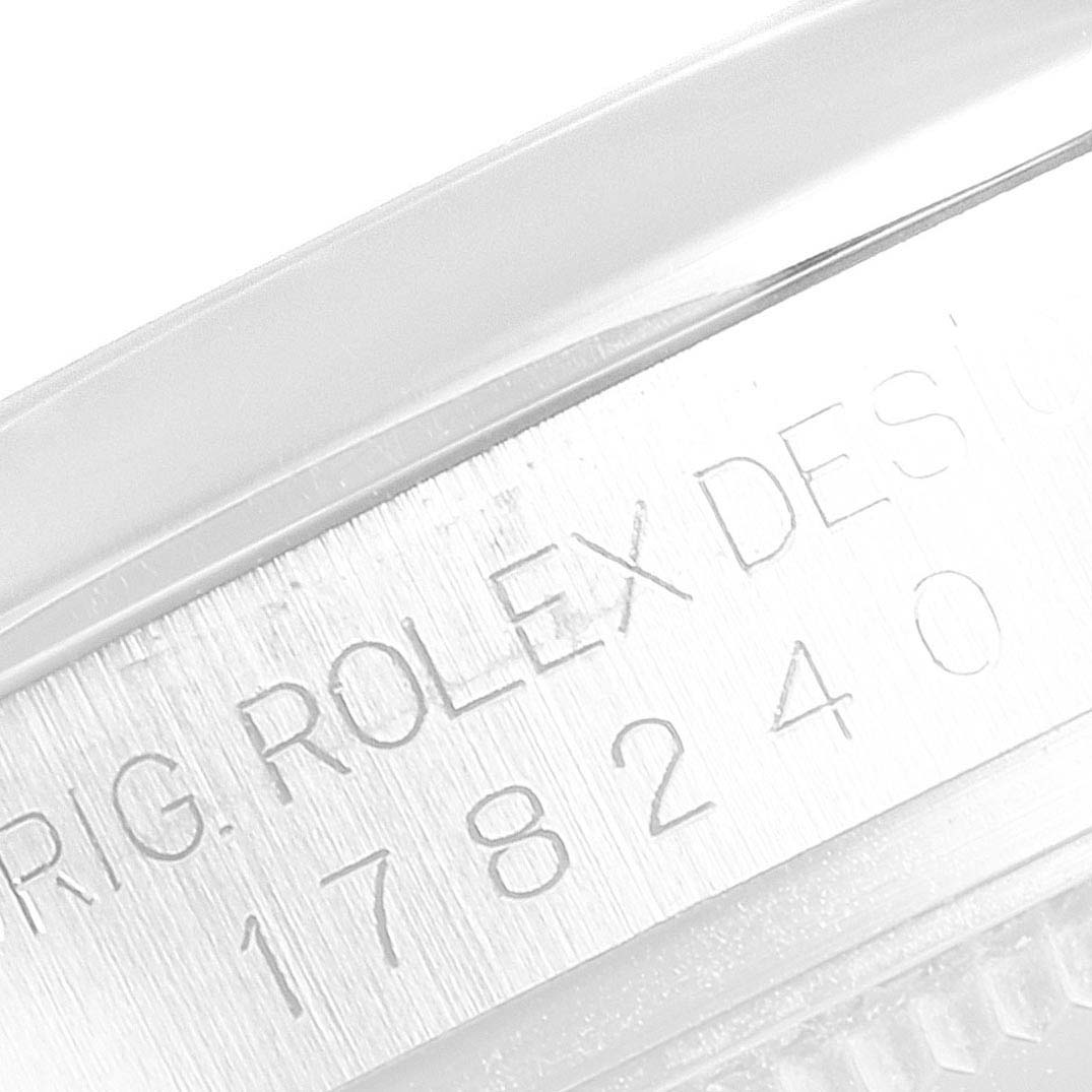 This image shows the reference number and "ROLEX DESIGN" engraving on the side of a Mid-Size Rolex watch case.