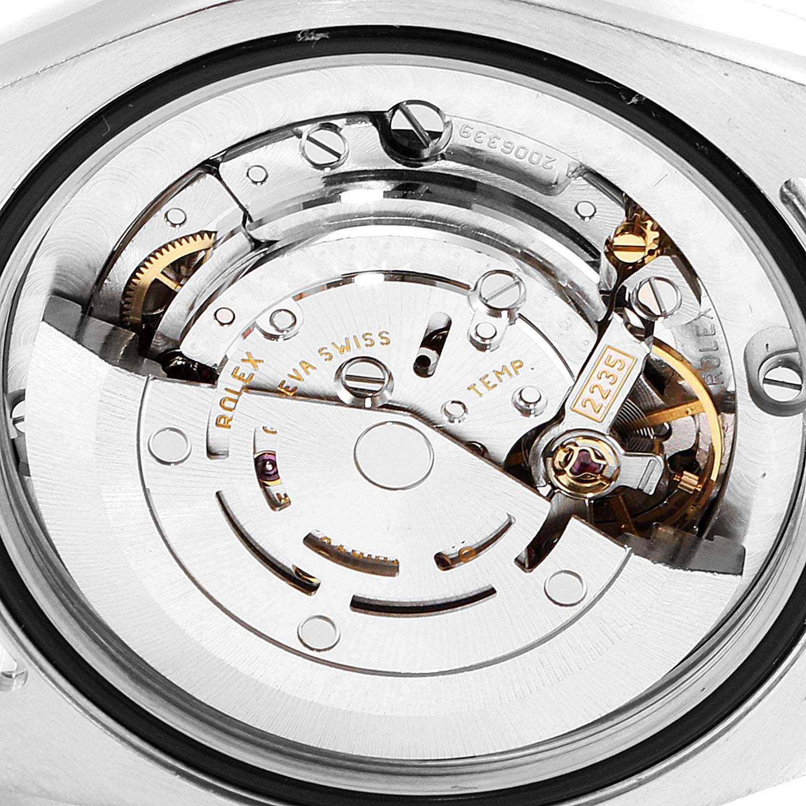 The image shows the mechanism of a Rolex Mid-Size 178240 Women
s Stainless Steel Black Dial 178240 Women
s Stainless Steel Black Dial model watch from a back angle, highlighting its intricate internal components.