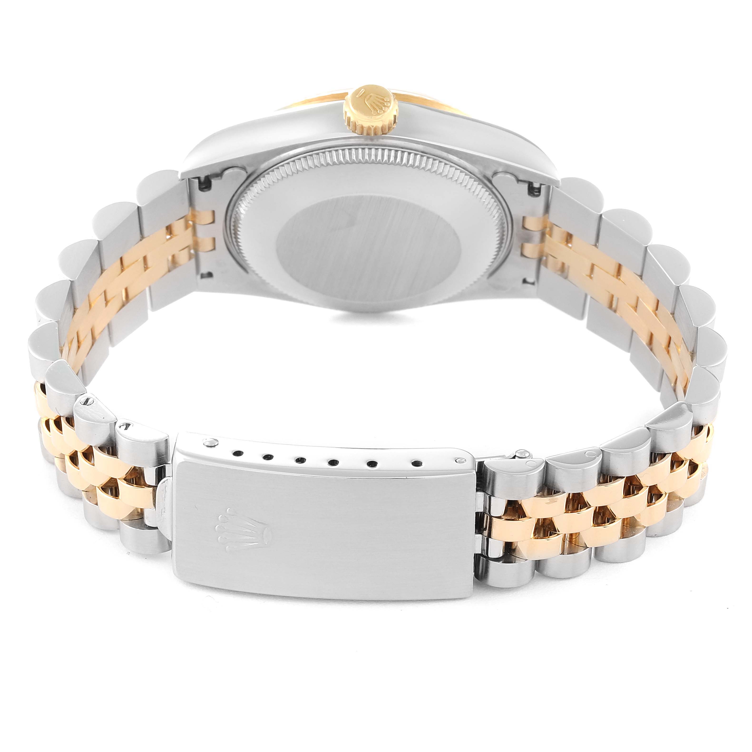 The image shows the backside and bracelet of a Mid-Size Rolex watch, highlighting the clasp and crown.