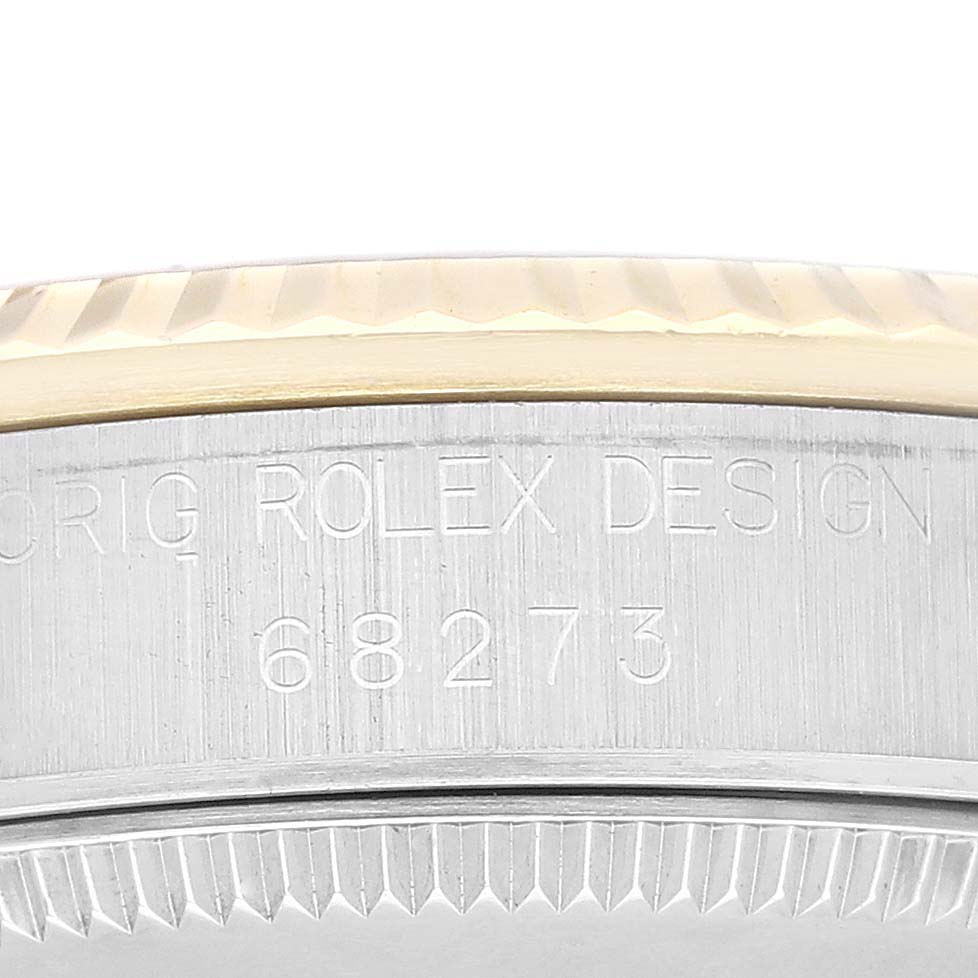 The image shows a close-up of the side bezel and case, displaying the watch model number "68273" by Rolex Mid-Size 68273G Women
s Steel and Gold (two tone) Champagne Dial 68273G Women
s Steel and Gold (two tone) Champagne Dial.