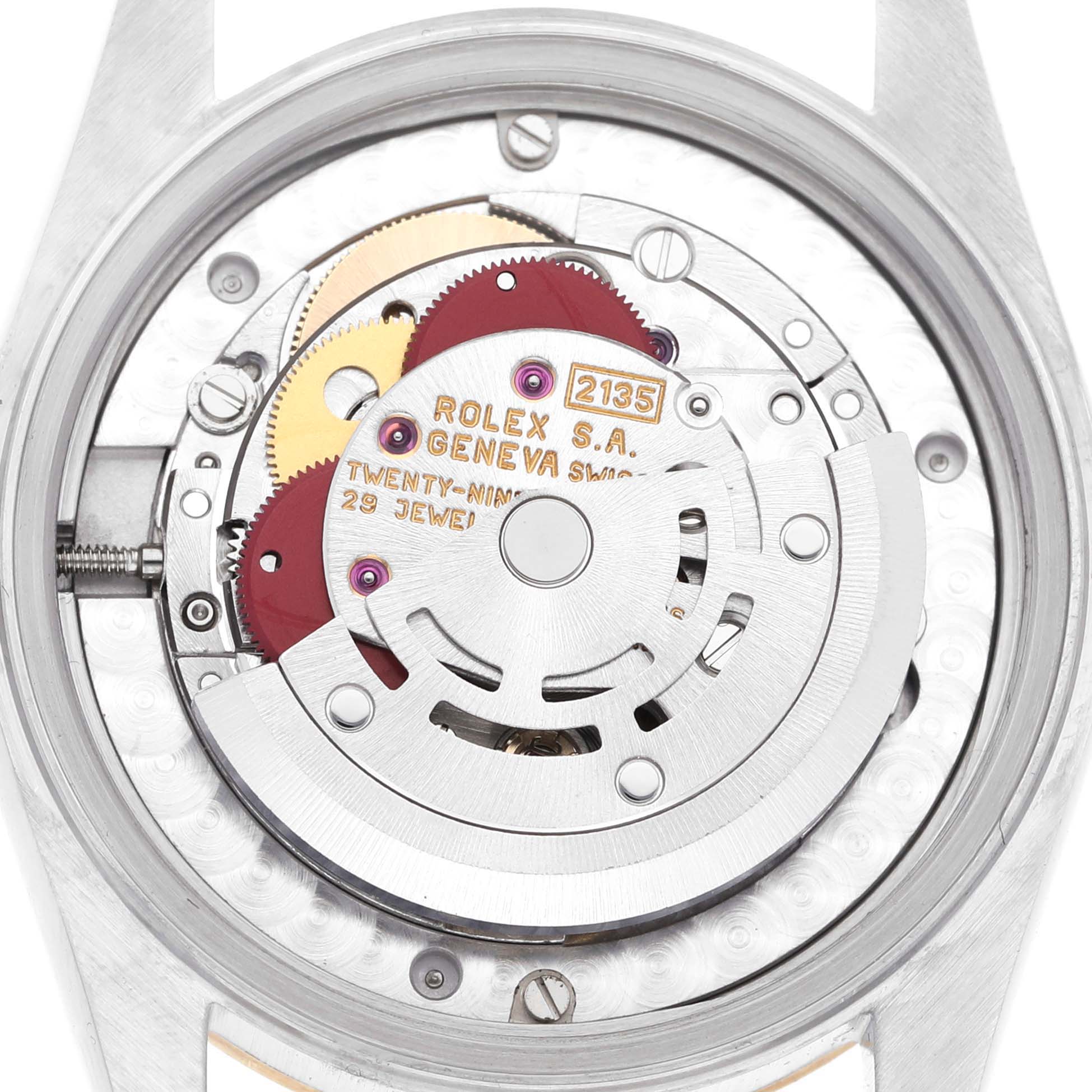 This image shows the internal mechanical movement from the back of the Rolex Mid-Size 68273G Women
s Steel and Gold (two tone) Champagne Dial 68273G Women
s Steel and Gold (two tone) Champagne Dial watch, showcasing gears and jewels.