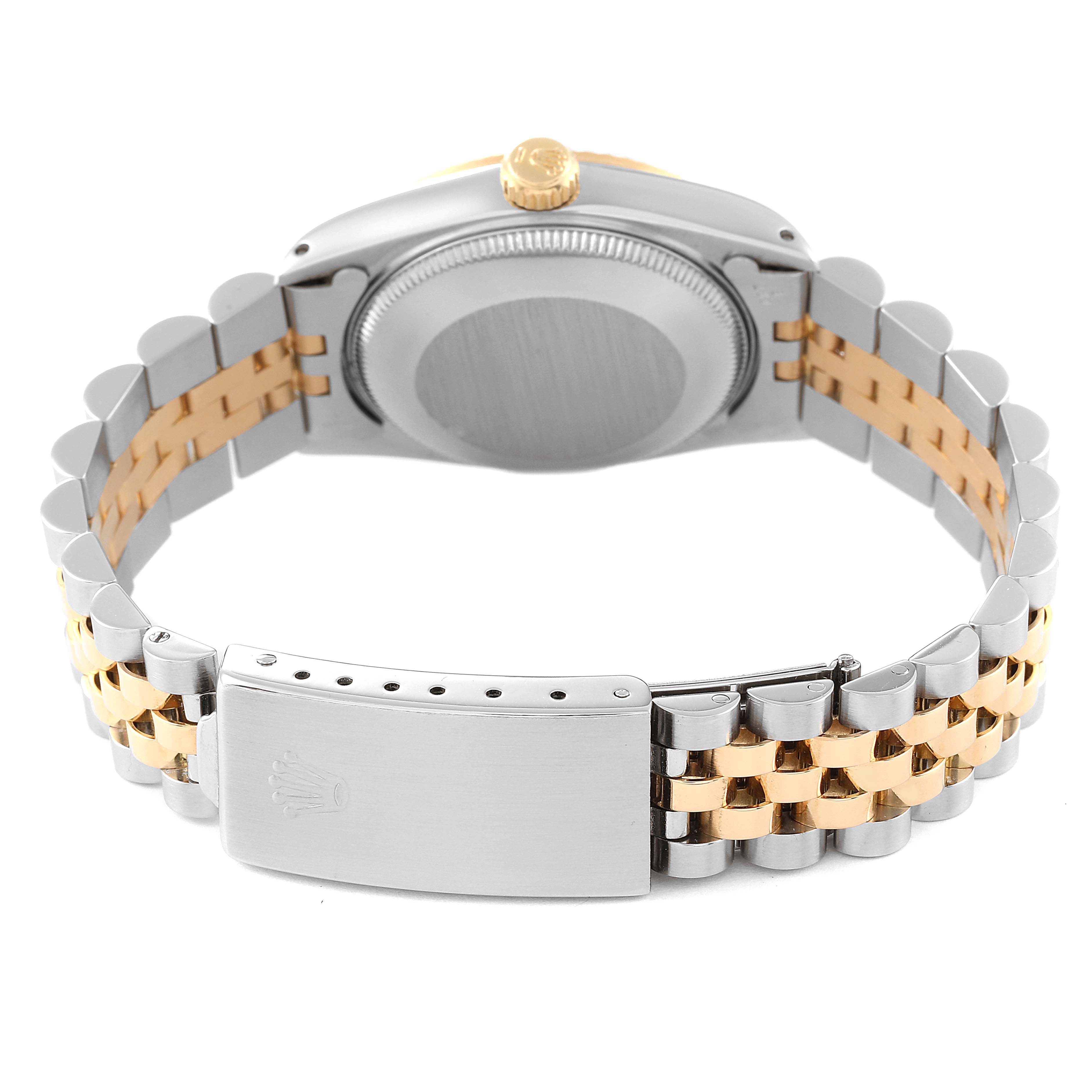 The image shows the back view of a Mid-Size Rolex watch, highlighting the case back, crown, and bracelet with a clasp.