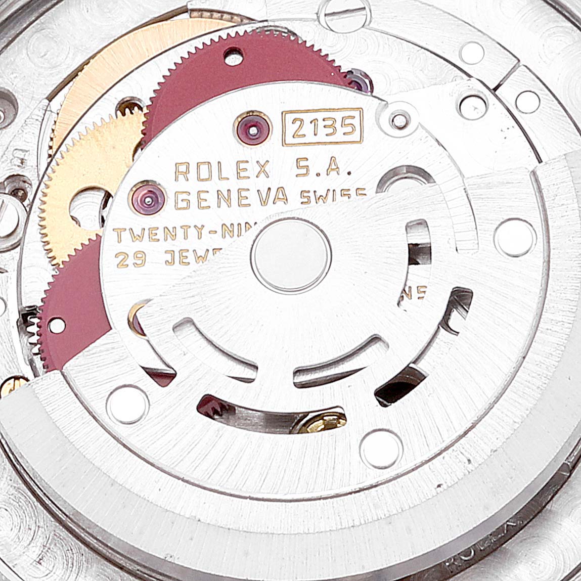This image shows the internal mechanical movement of a Rolex Mid-Size 68273 Women
s Steel and Gold (two tone) Champagne Dial 68273 Women
s Steel and Gold (two tone) Champagne Dial model, highlighting the gears and components from a close-up angle.
