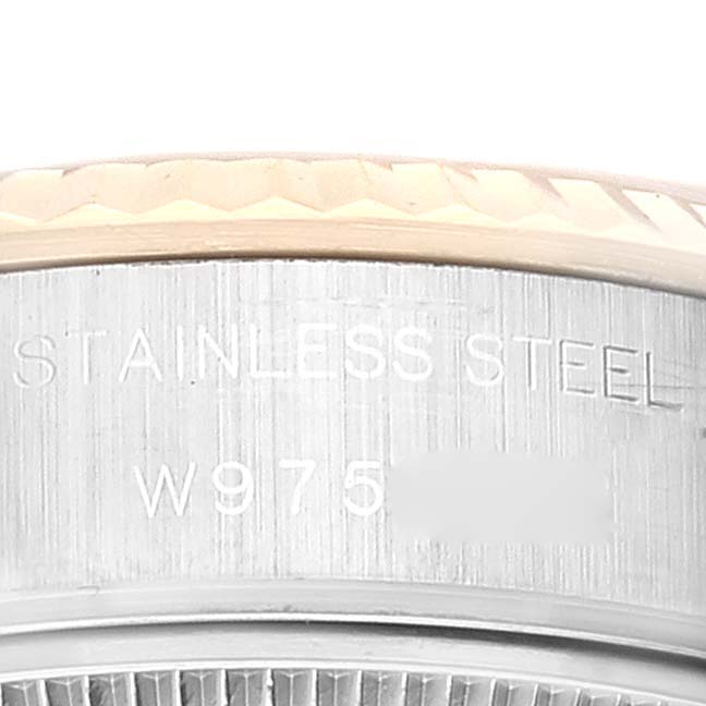 This close-up image shows a portion of the stainless steel case and bezel of a Rolex Datejust 69173 Women's Steel and Gold (two tone) Grey Dial 69173 Women's Steel and Gold (two tone) Grey Dial watch.