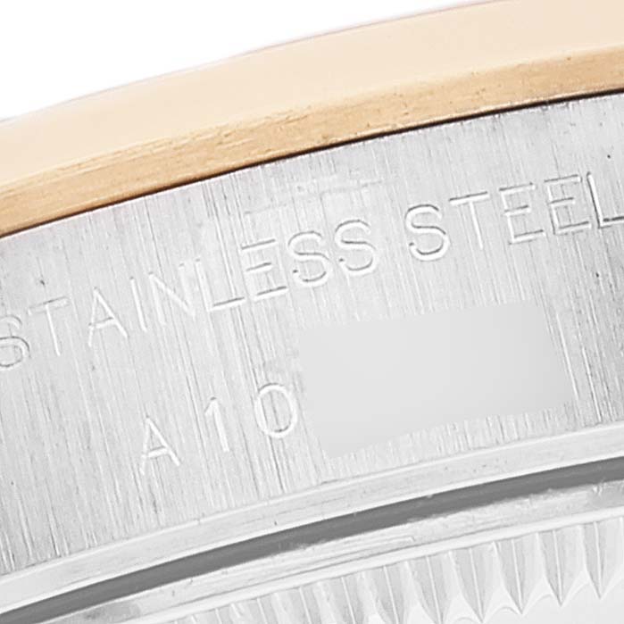 This close-up photo shows part of the stainless steel case back of a Rolex Datejust 79163 Women's Steel and Gold (two tone) White Dial 79163 Women's Steel and Gold (two tone) White Dial watch, including the engraved text.