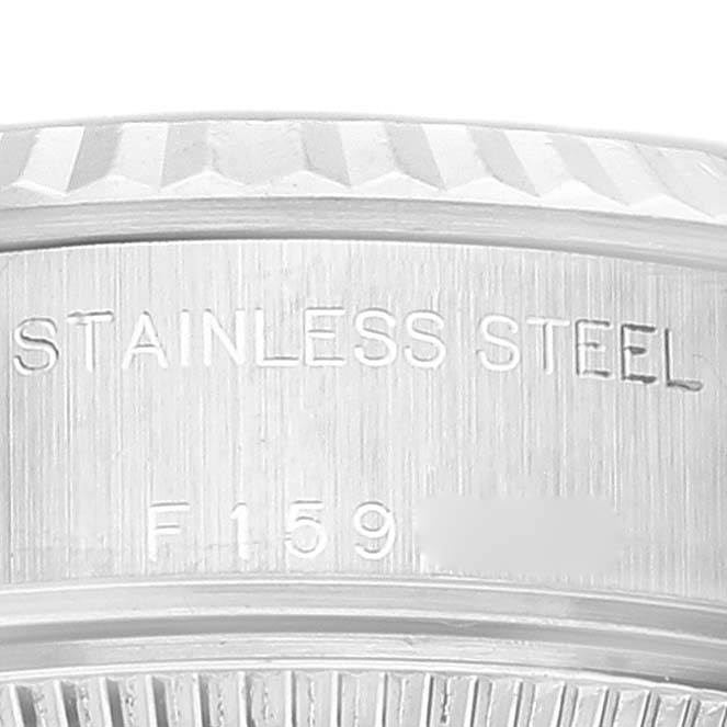 The image shows a close-up of the stainless steel case back and part of the edge of a Rolex Datejust 79174 Women's Stainless Steel Mother of Pearl Dial 79174 Women's Stainless Steel Mother of Pearl Dial watch.