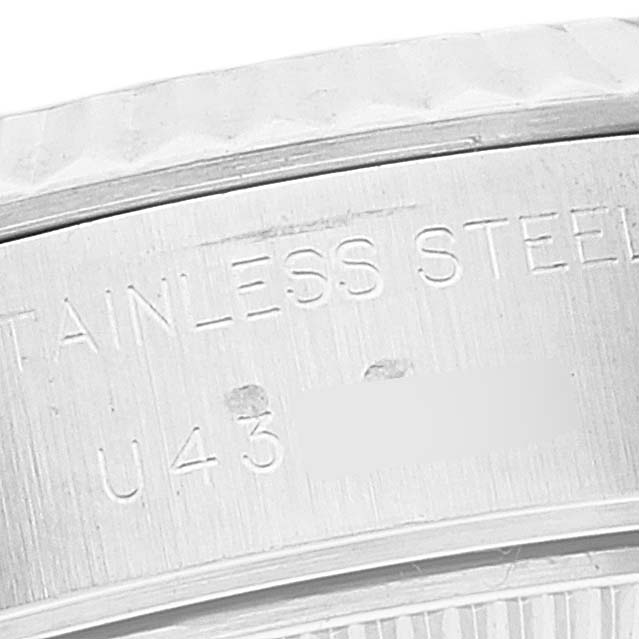This image shows a close-up of the case back inscription on a stainless steel Rolex Datejust 69174 Women's Stainless Steel Silver Dial 69174 Women's Stainless Steel Silver Dial watch.