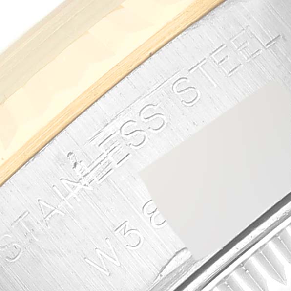 This close-up shows part of the stainless steel case and engraved text on the Rolex Datejust 69173 Women's Steel and Gold (two tone) Black Dial 69173 Women's Steel and Gold (two tone) Black Dial watch.