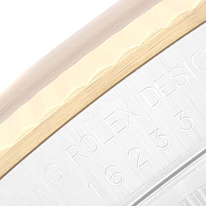 This image shows a close-up of the bezel and outer edge of a Rolex Datejust 16233 Men's Steel and Gold (two tone) Black Dial 16233 Men's Steel and Gold (two tone) Black Dial watch, highlighting the engravings.