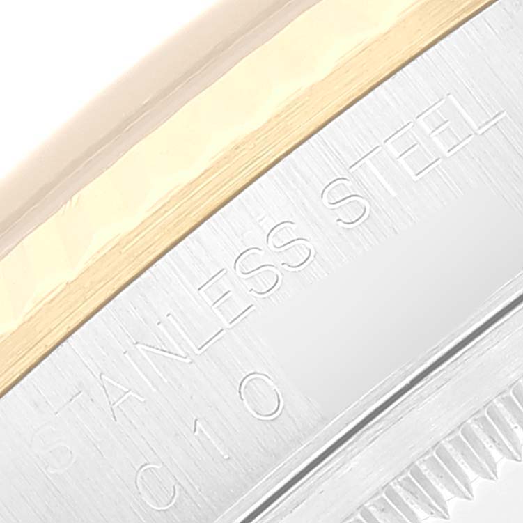 The image shows a close-up view of the case back and edge of the bezel of a Rolex Datejust 16233 Men's Steel and Gold (two tone) Black Dial 16233 Men's Steel and Gold (two tone) Black Dial watch, highlighting the stainless steel and gold components.