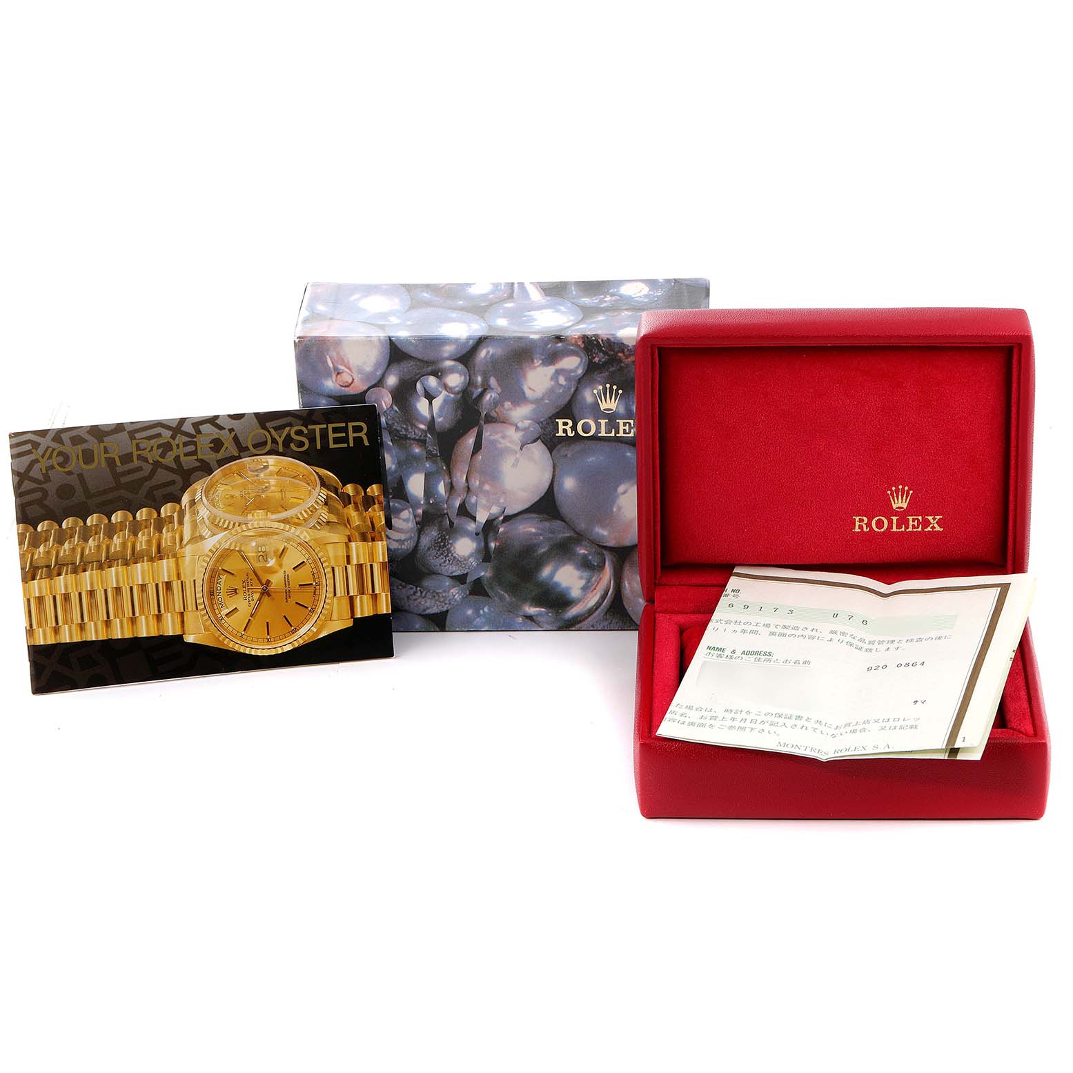 This image shows a Rolex Datejust 69173 Women's Steel and Gold (two tone) Champagne Dial 69173 Women's Steel and Gold (two tone) Champagne Dial model watch box, booklet, and an open red case with a certificate.