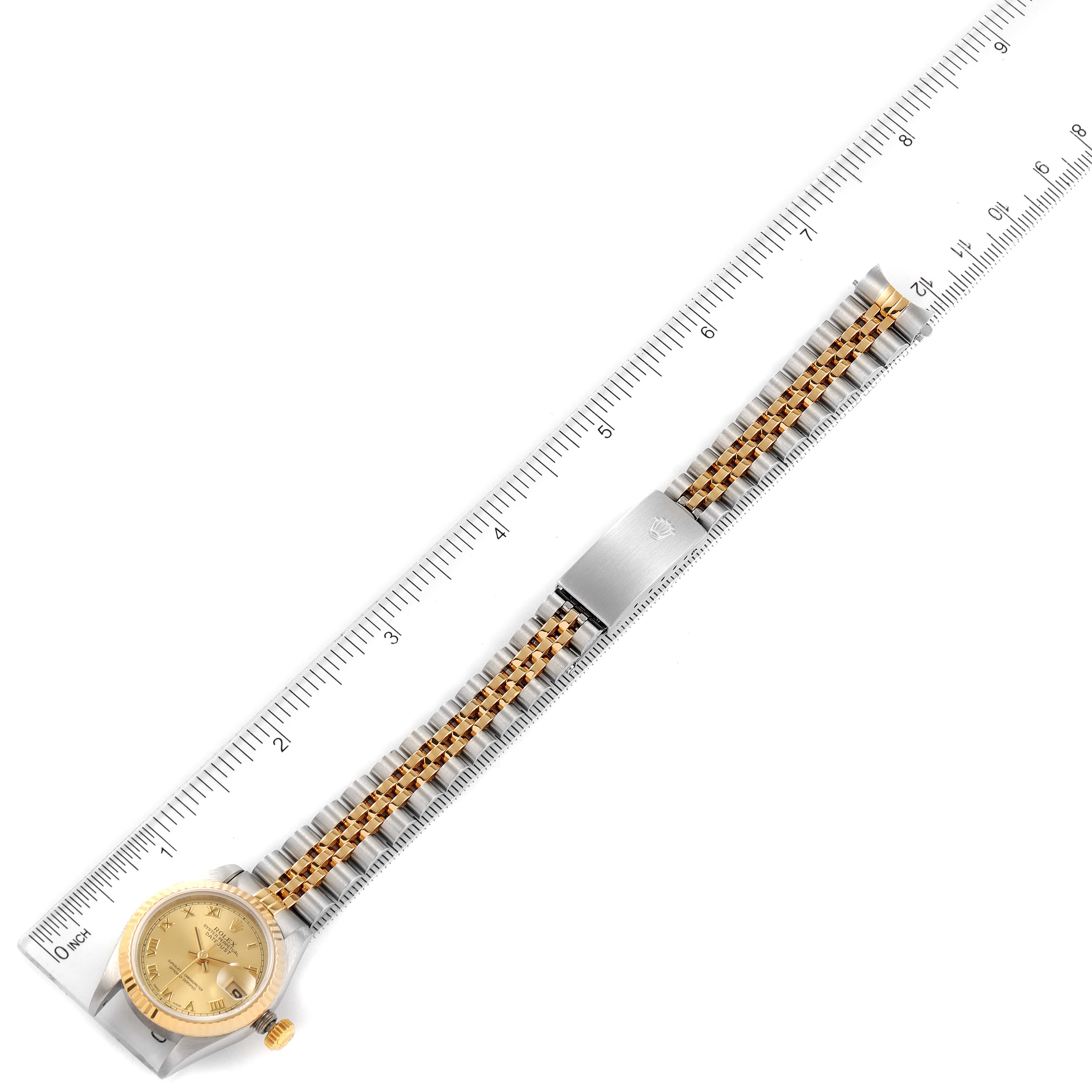 This image shows a straight top-down view of a Rolex Datejust 69173 Women's Steel and Gold (two tone) Champagne Dial 69173 Women's Steel and Gold (two tone) Champagne Dial watch, highlighting the dial, bracelet, and clasp against a ruler.