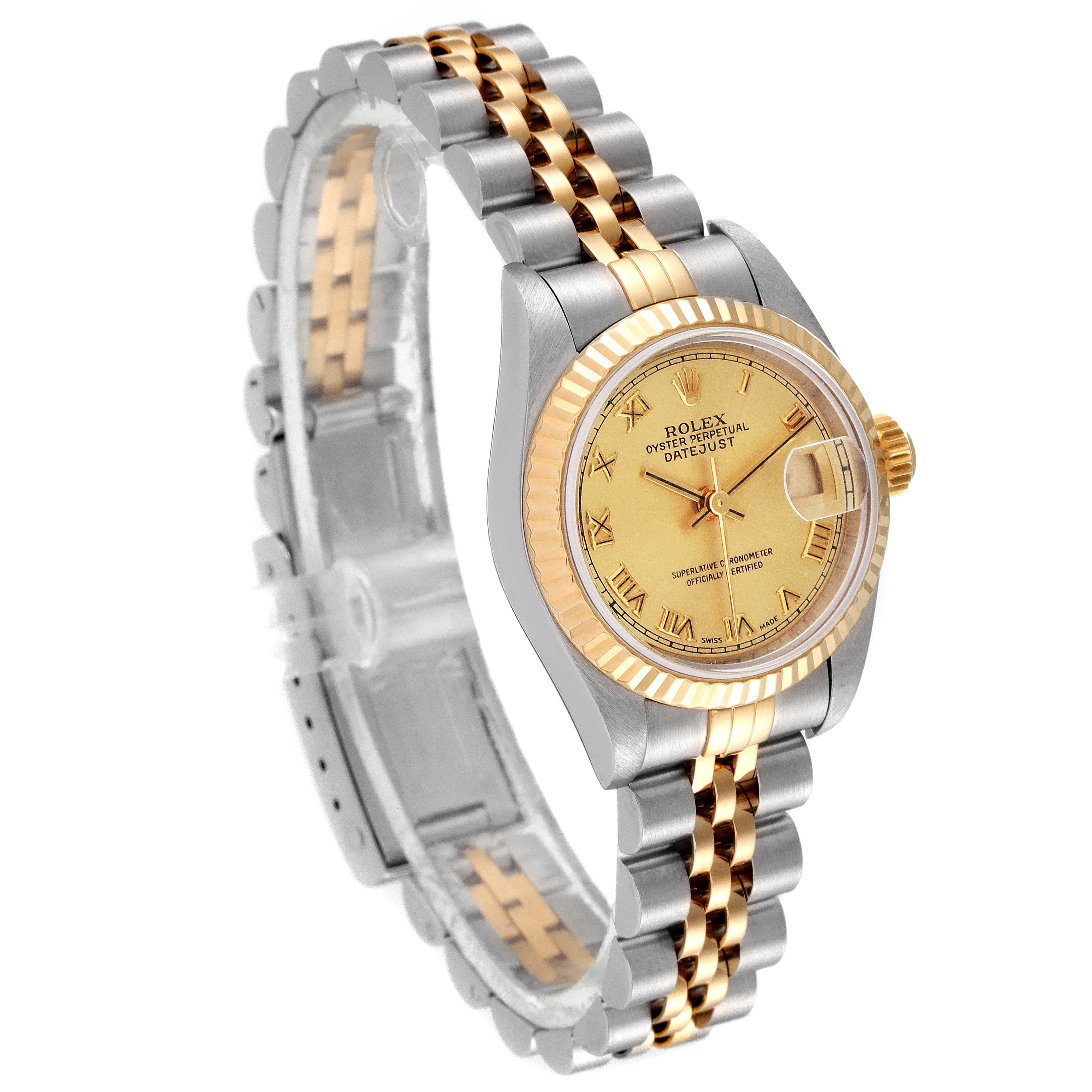 The Rolex Datejust 69173 Women's Steel and Gold (two tone) Champagne Dial 69173 Women's Steel and Gold (two tone) Champagne Dial model watch is shown from an angled view, displaying its gold dial, two-tone bracelet, and fluted bezel.