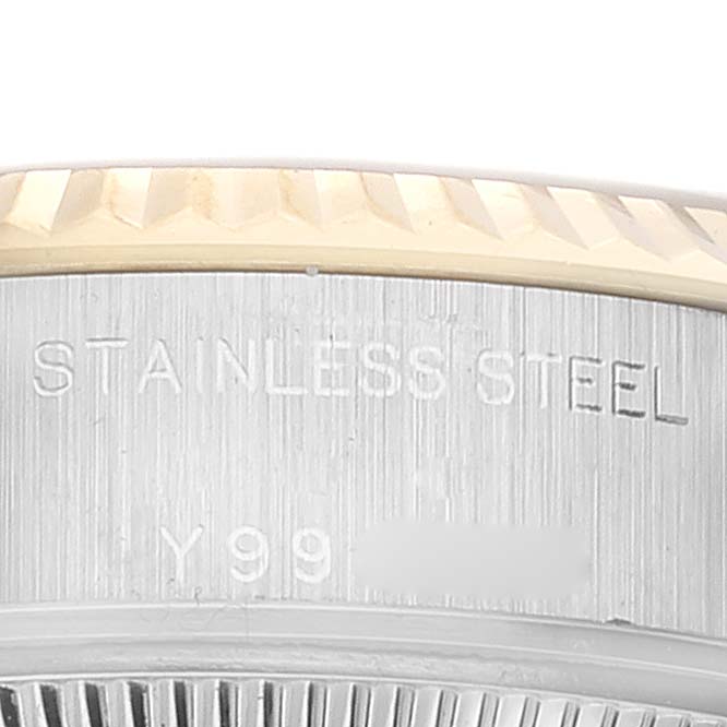 This image shows a close-up of the stainless steel side engraving and fluted bezel of a Rolex Datejust 79173 Women's Steel and Gold (two tone) Mother of Pearl Dial 79173 Women's Steel and Gold (two tone) Mother of Pearl Dial watch.