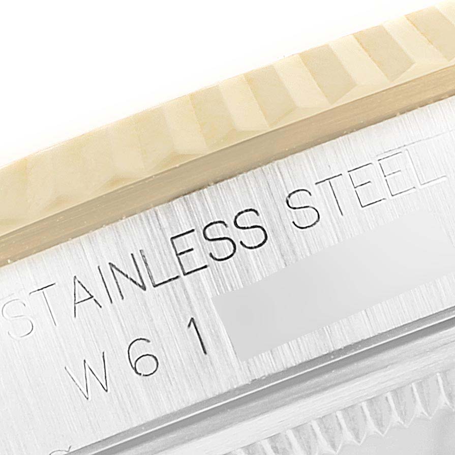 The image shows a close-up of the stainless steel side case with engraving details of the Rolex Datejust 16233 Men
s Steel and Gold (two tone) Grey Dial 16233 Men
s Steel and Gold (two tone) Grey Dial watch.