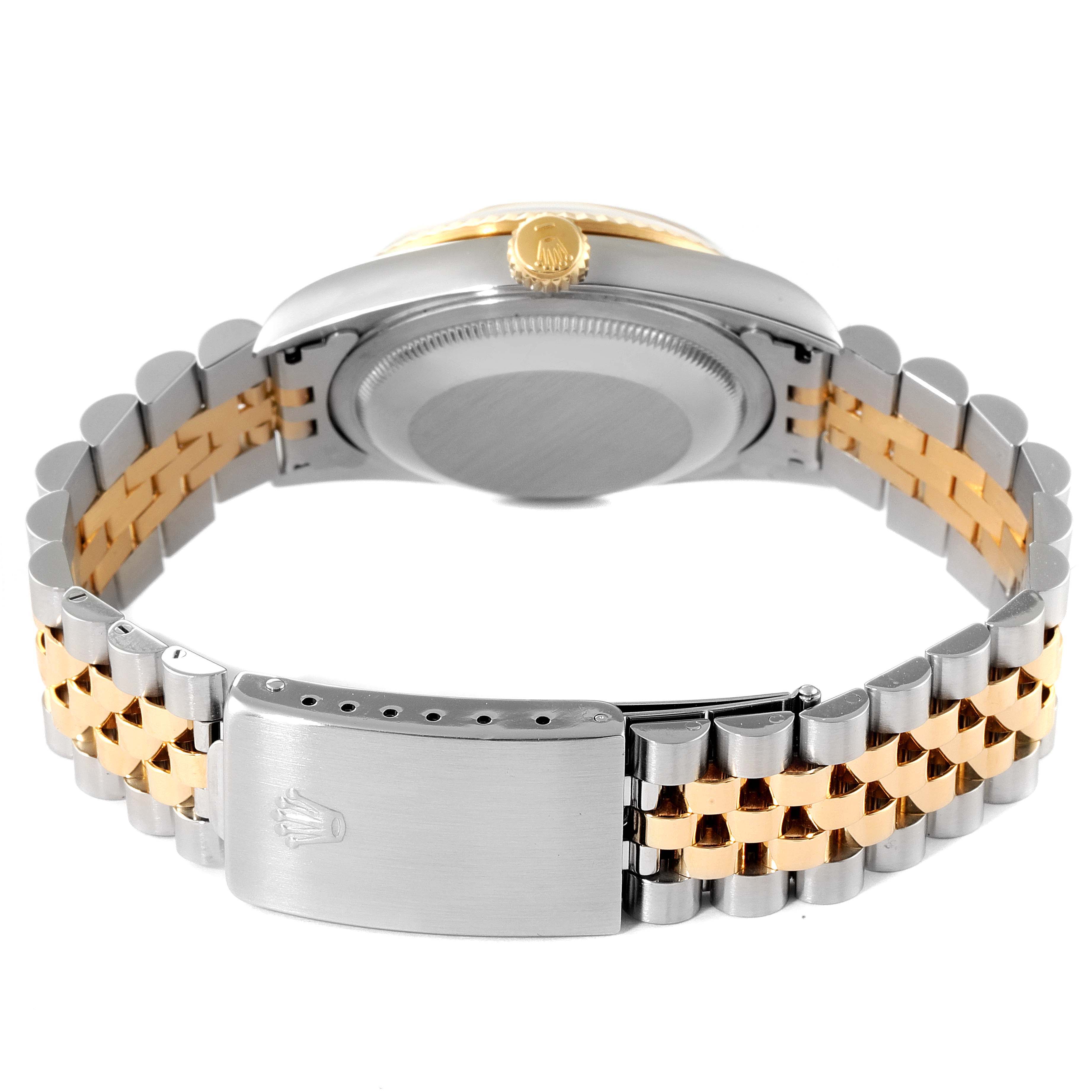 The image shows the back view of the Rolex Datejust 16233 Men's Steel and Gold (two tone) White Dial 16233 Men's Steel and Gold (two tone) White Dial watch, highlighting its clasp, crown, and two-tone bracelet.