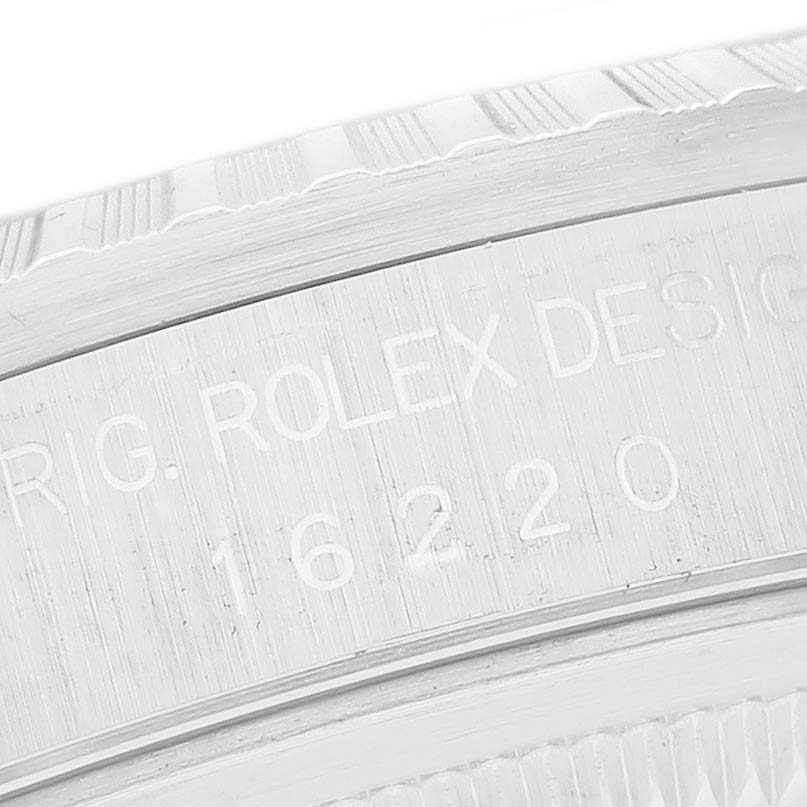This image shows a close-up of the engraved inner bezel (rehaut) of a Rolex Datejust 16220 Men's Stainless Steel White Dial 16220 Men's Stainless Steel White Dial model.