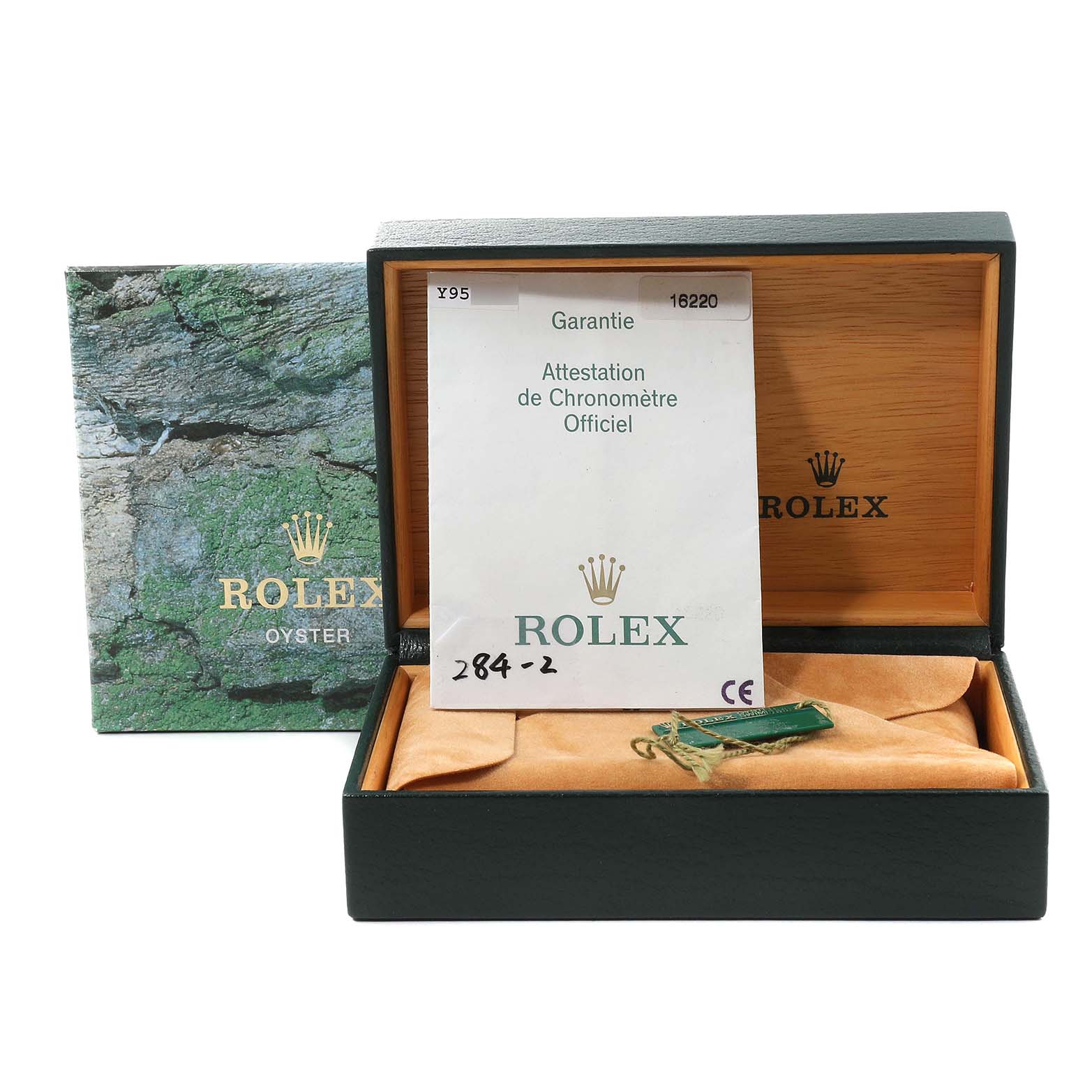 The image shows the box and warranty card for a Rolex Datejust 16220 Men's Stainless Steel White Dial 16220 Men's Stainless Steel White Dial model watch.