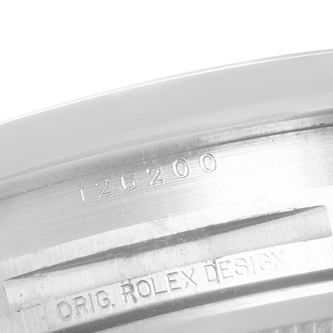 This close-up shows the engraved model number "126200" on the case of the Rolex Datejust 126200 Men's Stainless Steel White Dial 126200 Men's Stainless Steel White Dial watch.