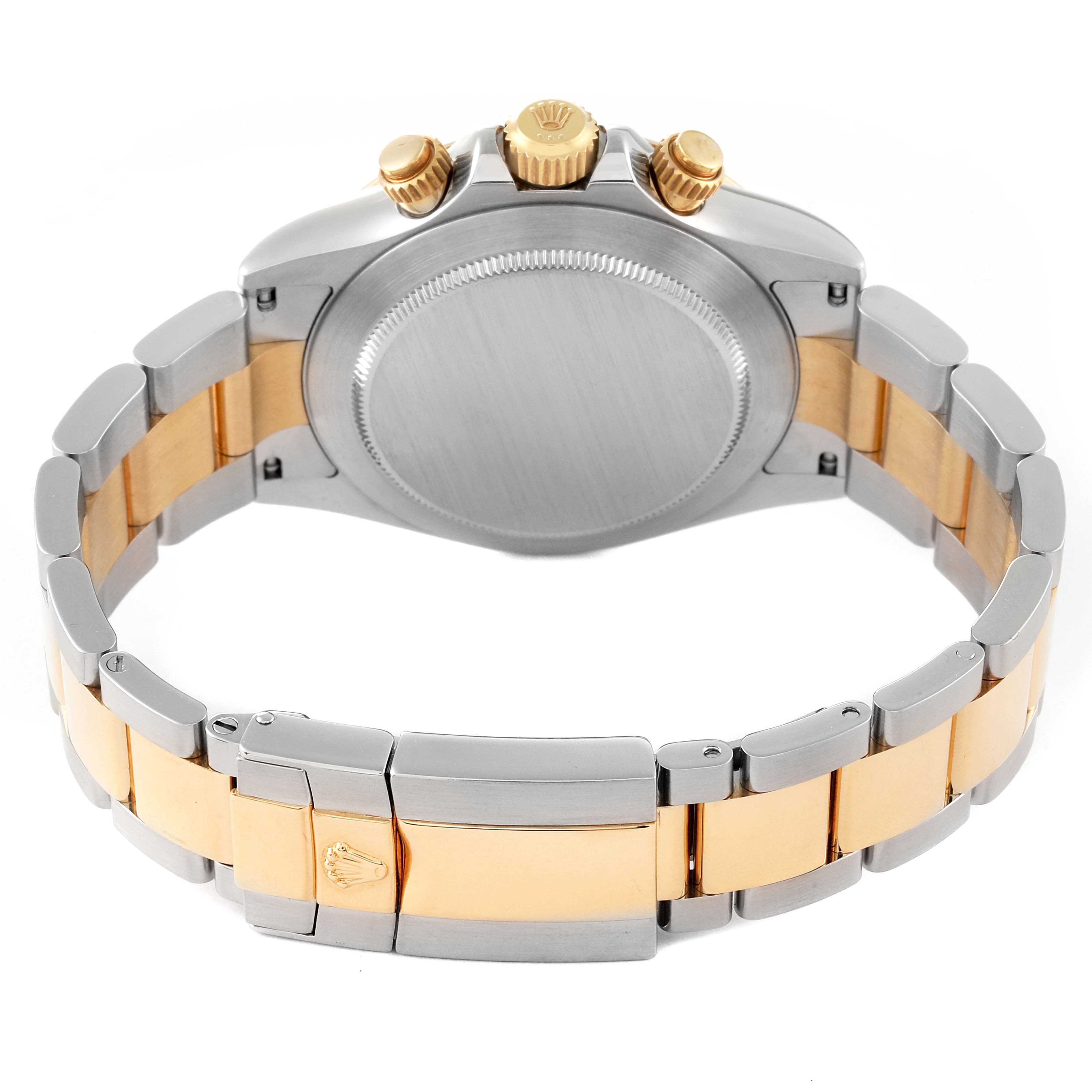 The image shows the back of a Rolex Daytona 116523 Men's Steel and Gold (two tone) Black Dial 116523 Men's Steel and Gold (two tone) Black Dial watch, focusing on its two-tone bracelet and the caseback, crown, and pushers.