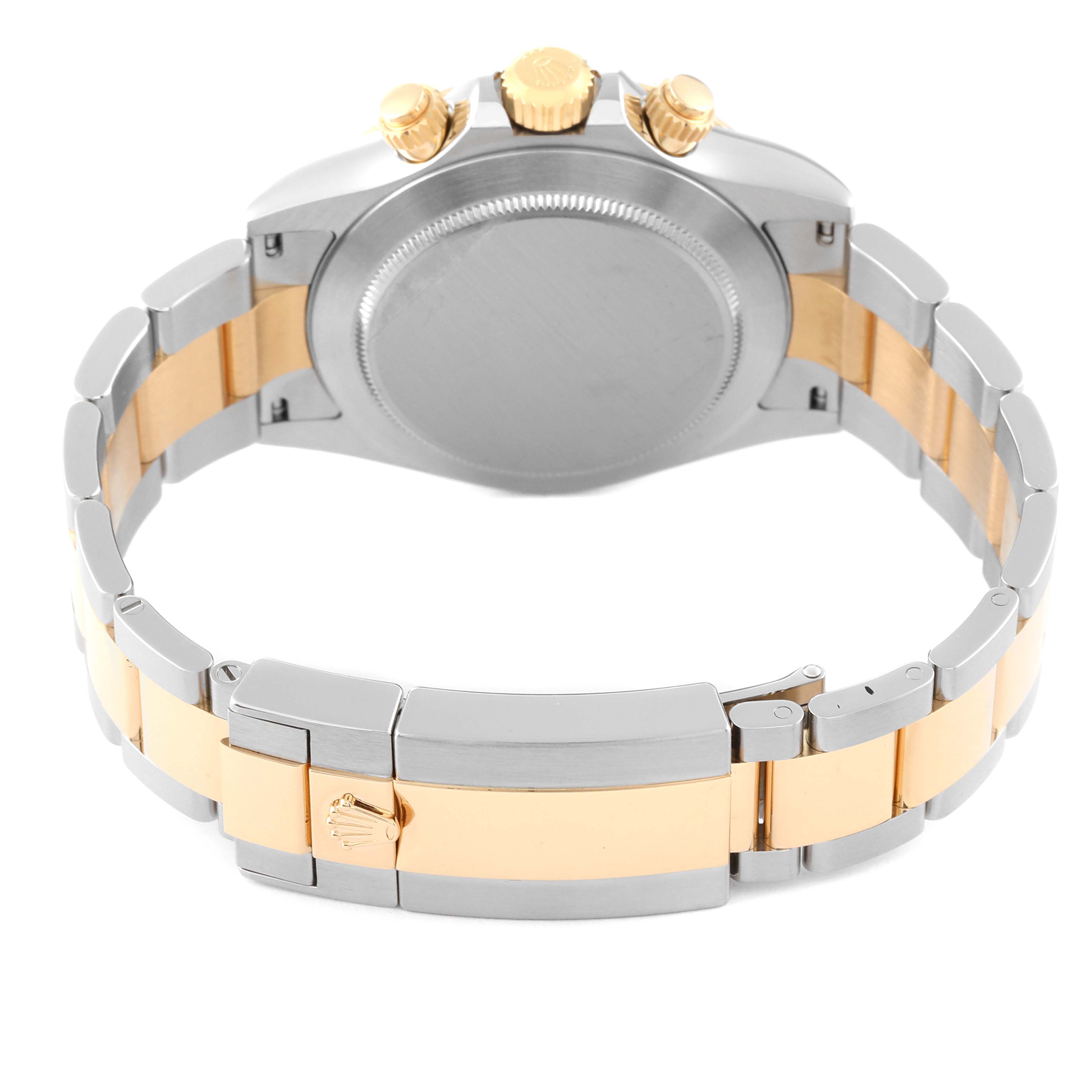 The image shows the back of a Rolex Daytona 116523 Men's Steel and Gold (two tone) Mother of Pearl Dial 116523 Men's Steel and Gold (two tone) Mother of Pearl Dial watch, highlighting the clasp and band with gold and silver tones.