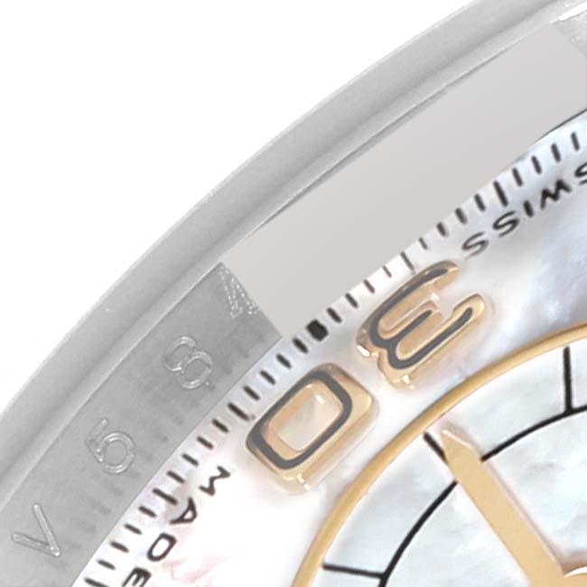 The image shows a close-up of the dial and bezel of a Rolex Daytona 116523 Men's Steel and Gold (two tone) Mother of Pearl Dial 116523 Men's Steel and Gold (two tone) Mother of Pearl Dial watch, highlighting a portion of the hour markers and edge details.