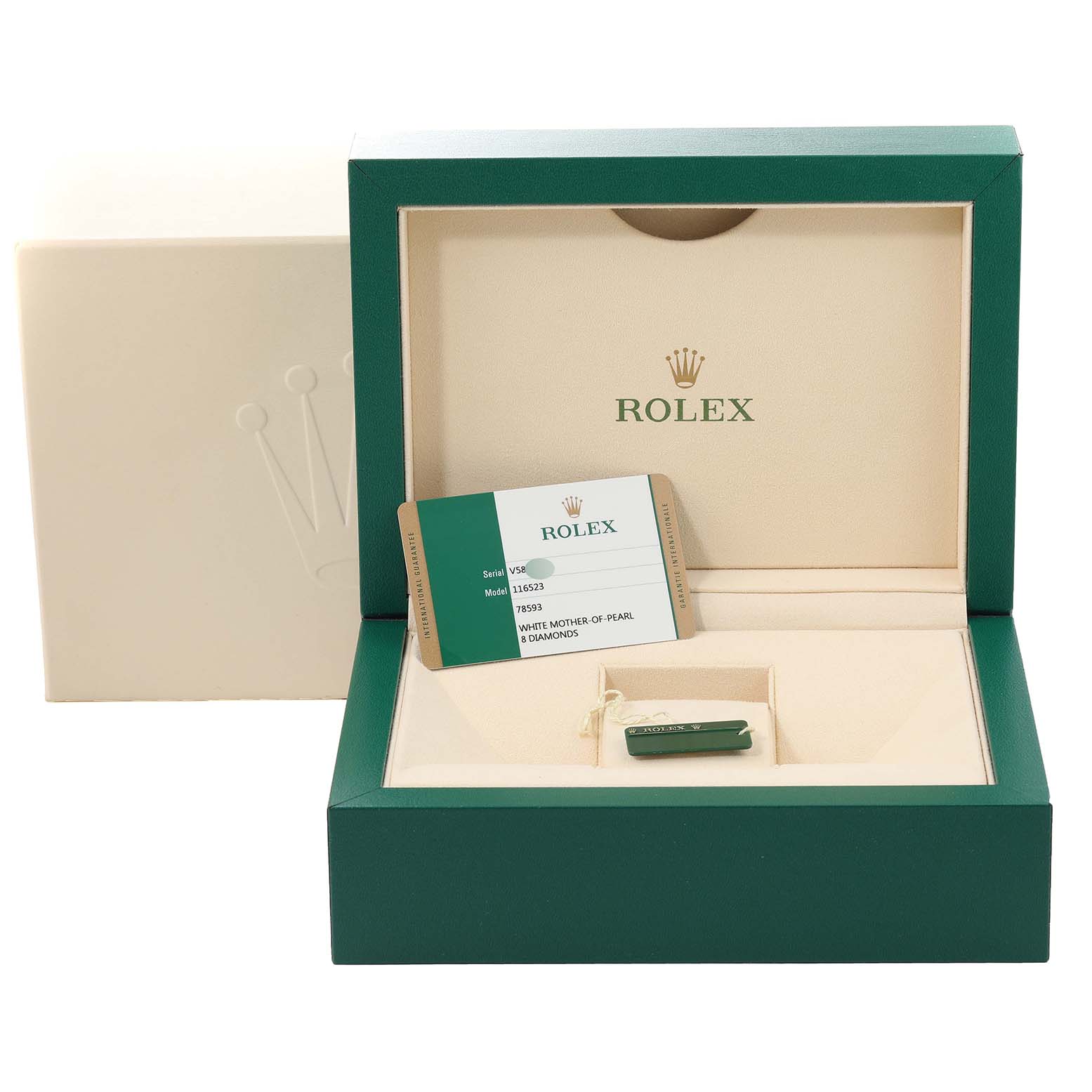 The image shows an open green Rolex Daytona 116523 Men's Steel and Gold (two tone) Mother of Pearl Dial 116523 Men's Steel and Gold (two tone) Mother of Pearl Dial watch box with a warranty card and a tag, viewed from the front.