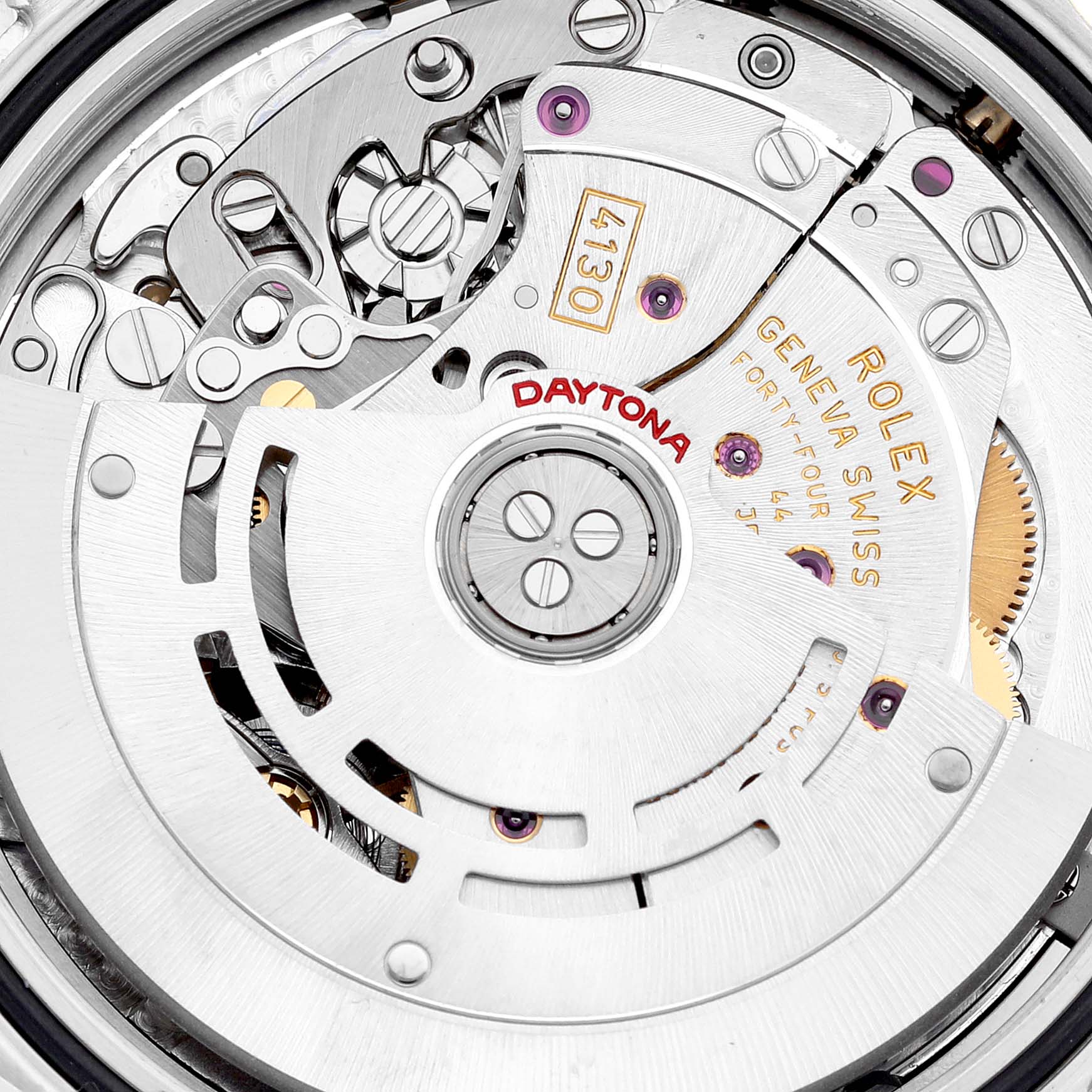 This close-up image shows the intricate movement of a Rolex Daytona 116523 Men's Steel and Gold (two tone) Mother of Pearl Dial 116523 Men's Steel and Gold (two tone) Mother of Pearl Dial watch, featuring gears and the rotor.