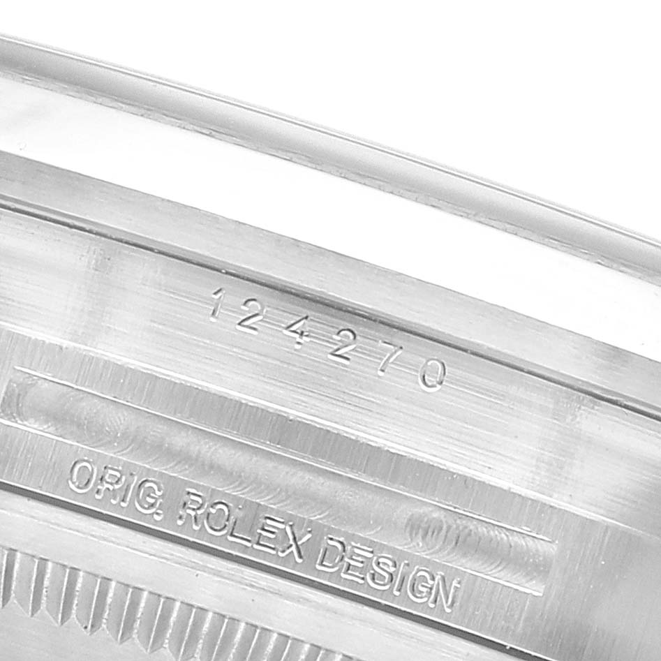 This image shows the inner side of the Rolex Explorer 124270 Men
s Stainless Steel Black Dial 124270 Men
s Stainless Steel Black Dial watch case, displaying its model number and the "Orig. Rolex Design" engraving.