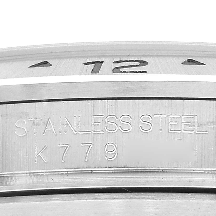 This image shows a close-up of the stainless steel case back and part of the dial of the Rolex Explorer 16570 Men
s Stainless Steel Black Dial 16570 Men
s Stainless Steel Black Dial watch.