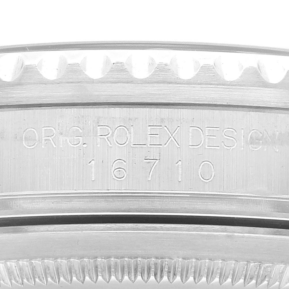 The image shows a close-up of the case side with the model engraving "16710" of a Rolex GMT-Master 16710 Men
s Stainless Steel Black Dial 16710 Men
s Stainless Steel Black Dial watch.