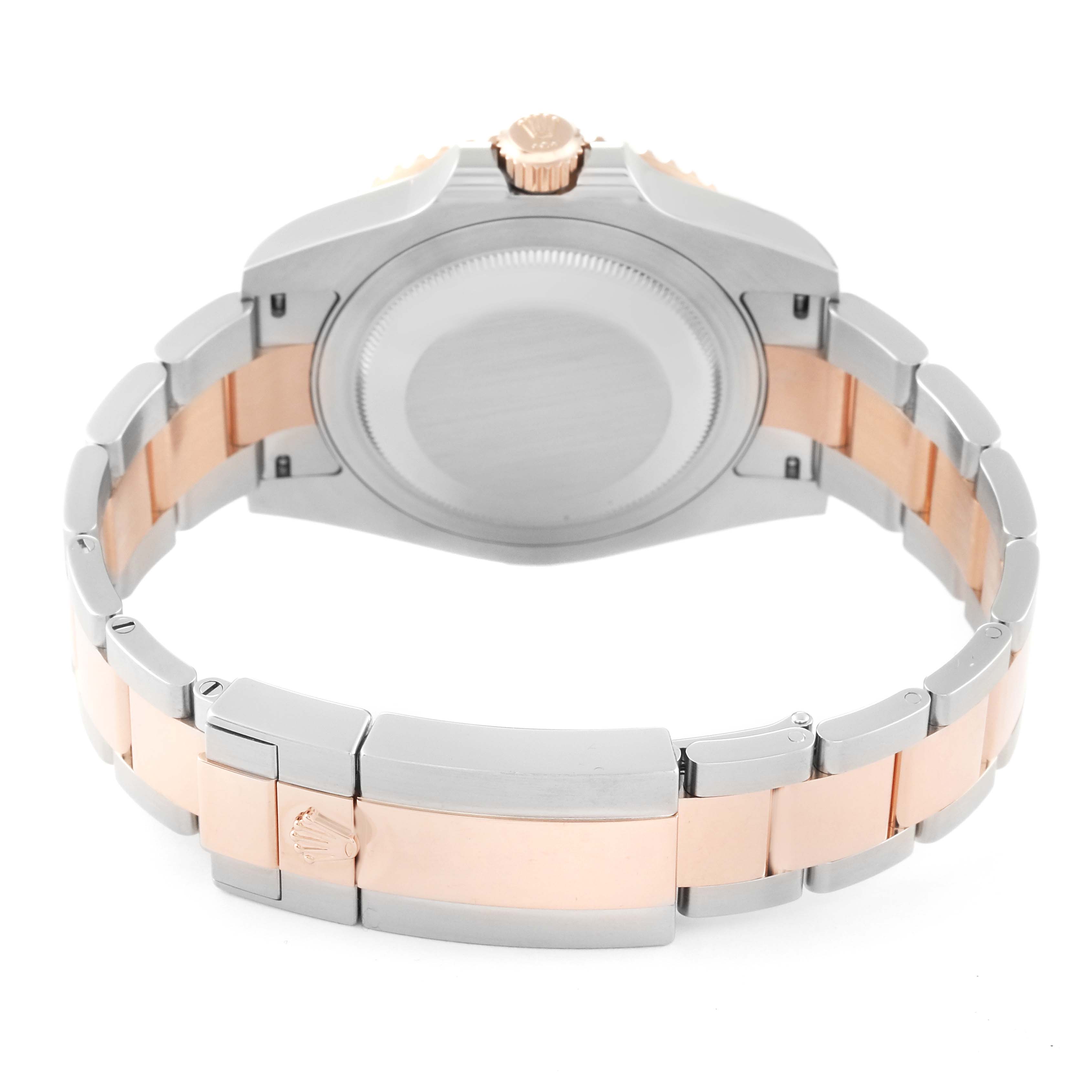 This image shows the back view of a Rolex GMT-Master 126711CHNR Men's Steel and Gold (two tone) Black Dial 126711CHNR Men's Steel and Gold (two tone) Black Dial watch, highlighting its case back, crown, and two-tone bracelet.