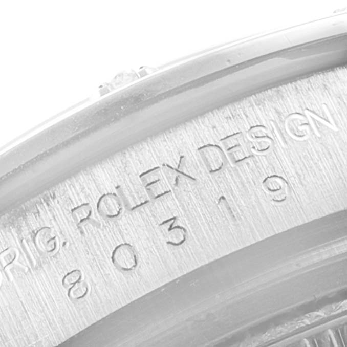 This image shows a close-up of the engraved bezel on a Rolex Pearlmaster 80319 Women's White Gold White Dial 80319 Women's White Gold White Dial watch, displaying the model and design number.