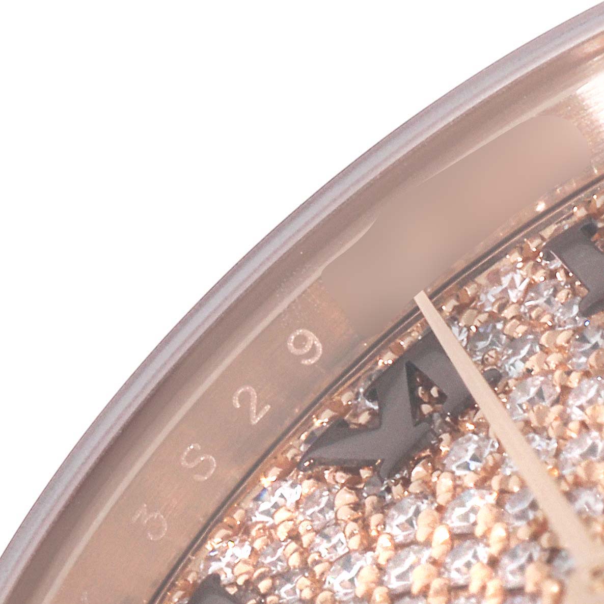 This close-up angle of the Rolex President 279135 Women's Rose Gold Champagne Dial 279135 Women's Rose Gold Champagne Dial model shows the crystal and part of the dial with diamond accents.