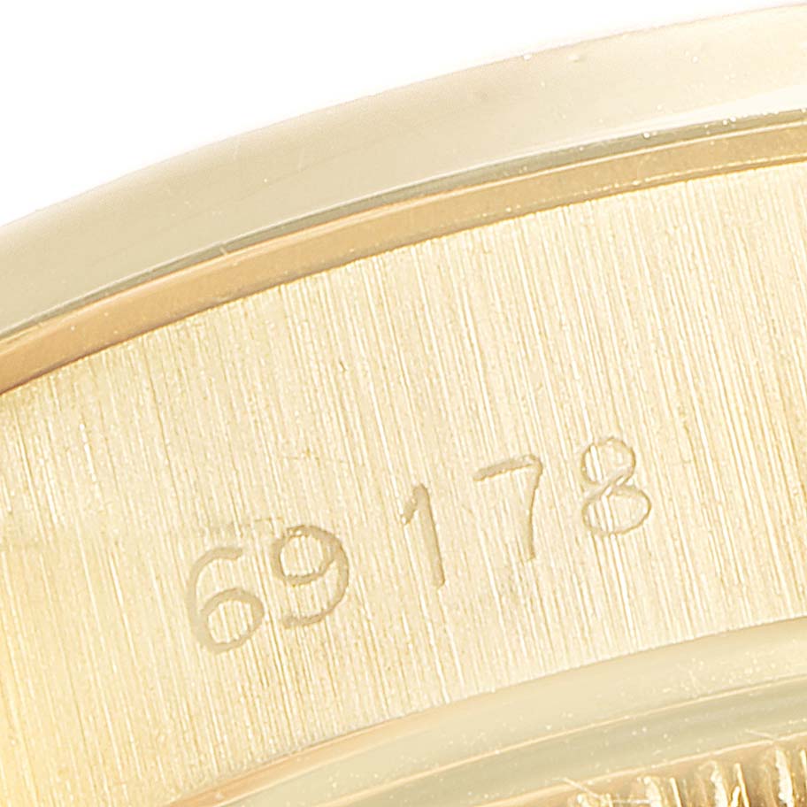 This image shows a close-up angle of the model number engraving on the gold case of a Rolex President 69178 Women's Yellow Gold Champagne Dial 69178 Women's Yellow Gold Champagne Dial watch.